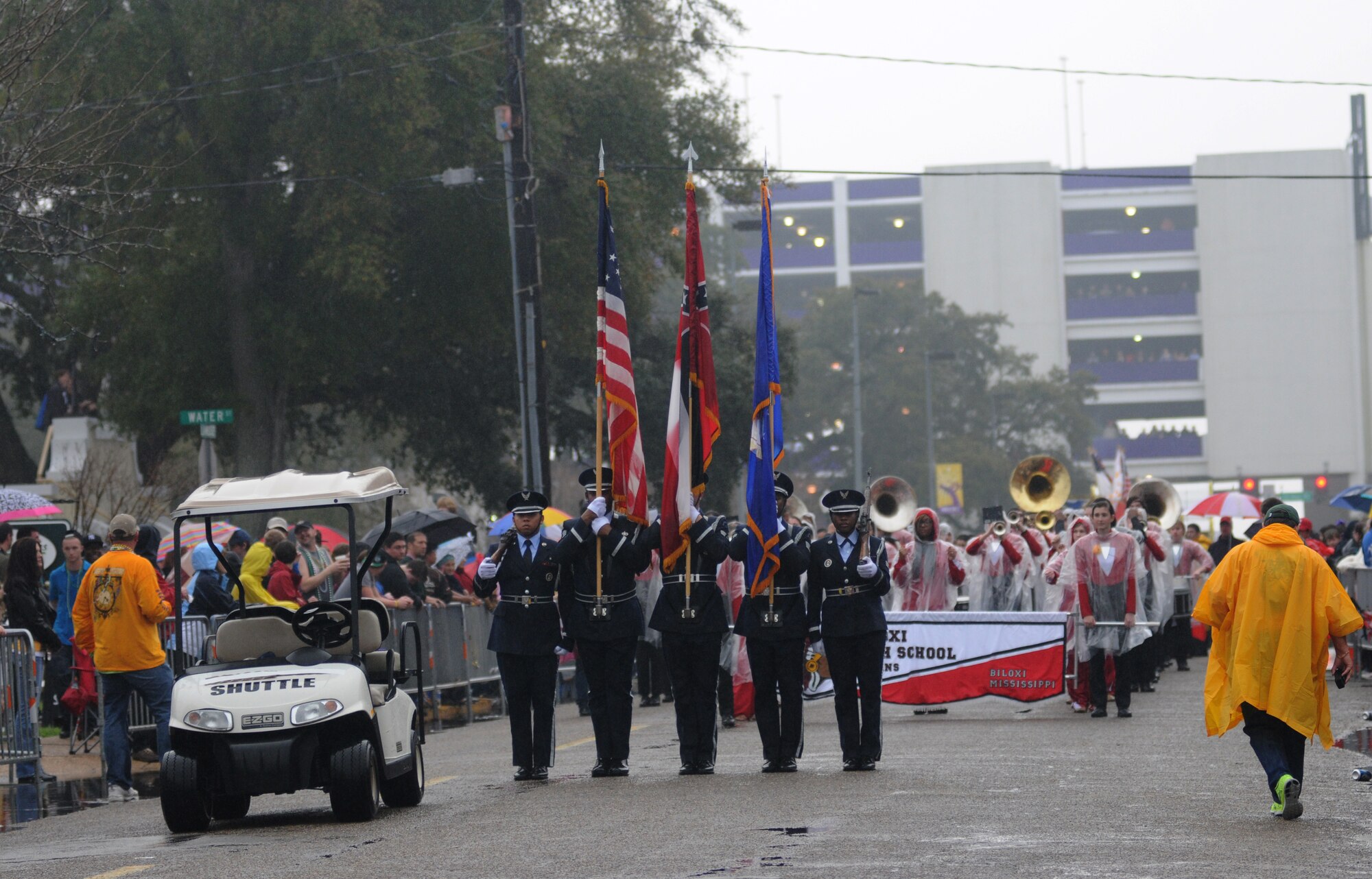 The Keesler Honor Guard leads the Gulf Coast Carnival Association Mardi Gras parade in Biloxi, Miss., Feb. 12, 2013. Lisa and Brig. Gen. Brad Spacy, 81st Training Wing commander, and Col. Craig LaFave, 403rd Wing commander, also participated in the festivities.  (U.S. Air Force photo by Kemberly Groue)