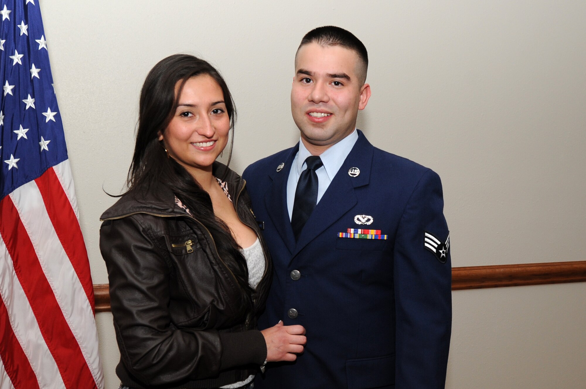 U.S. Air Force Airman 1st Class Fabio Castellanos, 27th Special Operations Civil Engineer Squadron, and his wife pose for a photo after a citizenship ceremony at Cannon Air Force Base, N.M., Feb. 8, 2013.  During the ceremony Castellanos and two other Air Commandos gained their U.S. Citizenship.  (U.S. Air Force photo/Senior Airman Jette Carr)