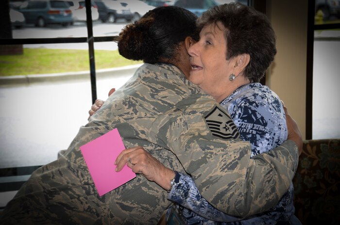 Master Sgt. Tiffany Robinson, 17th Airlift Squadron first sergeant, shares a hug with Mary Maddox during the National Salute a Veteran week, Feb. 12, 2013, at the VA Clinic at Joint Base Charleston – Weapons Station. Volunteers from Joint Base Charleston also visited VA clinics to give Valentine’s cards to veterans at the Ralph H. Johnson VA clinic and Trident VA clinic. (U.S. Air Force photo/Staff Sgt. Anthony Hyatt)