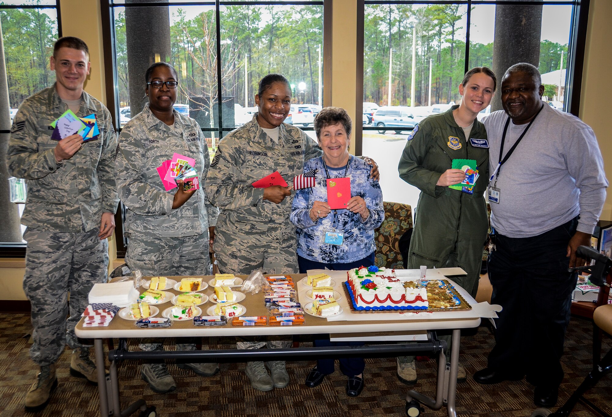 Airmen from Joint Base Charleston – Air Base share Valentine’s cards with veterans during National Salute a Veteran week, Feb. 12, 2013, at the Veteran’s Clinic at Joint Base Charleston – Weapons Station. Volunteers visited veterans at the Charleston VA hospital and Trident VA clinic. (U.S. Air Force photo/Staff Sgt. Anthony Hyatt)