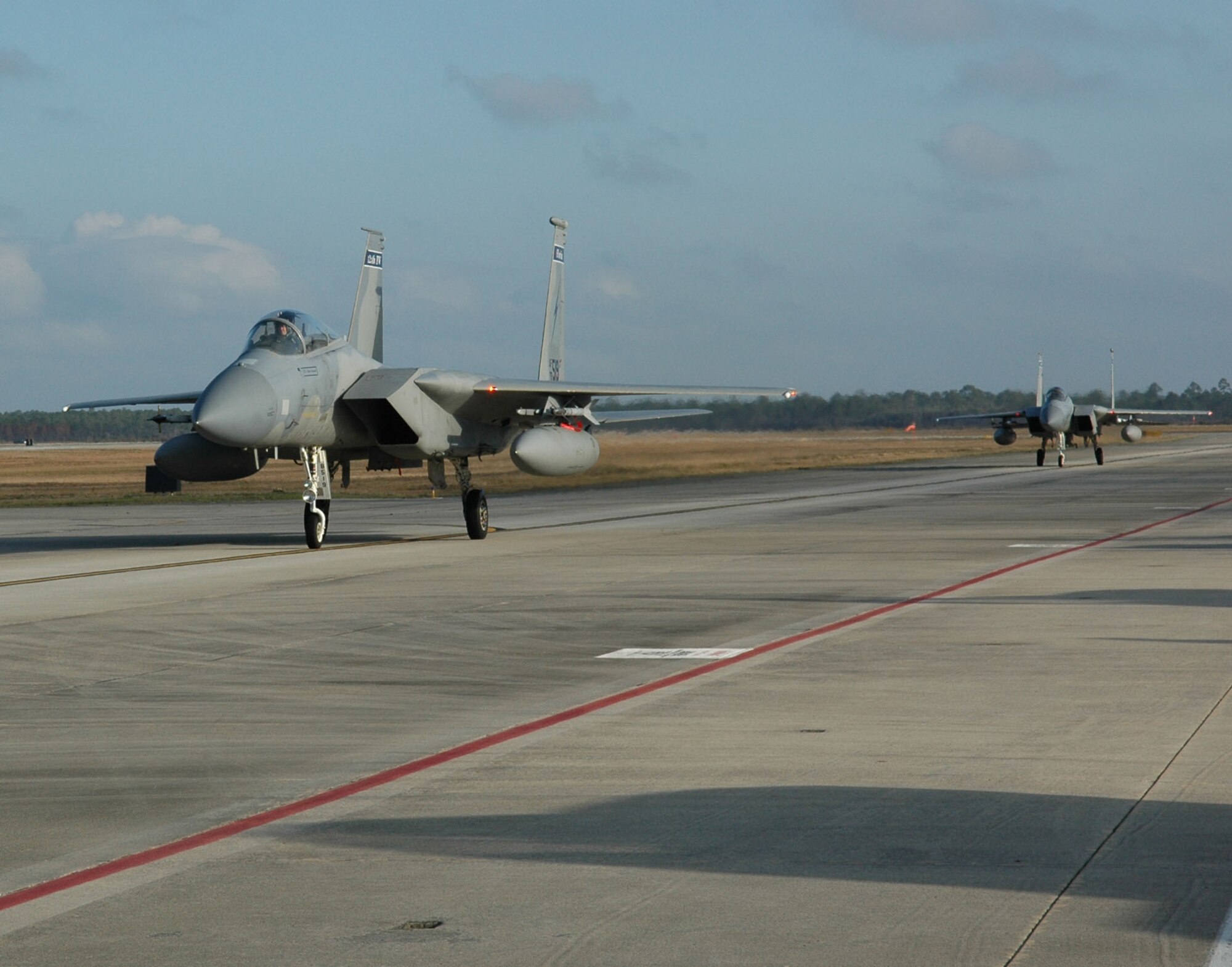 Two of Florida’s Air National Guard F-15C Eagles taxi down the runway during Combat Archer at Tyndall Air Force Base, Fla. The 53rd Weapons Evaluation Group recently conducted the air-to-air Weapons System Evaluation Program, known as Combat Archer, which exercises and evaluates the air-to-air weapon system capability of combat aircraft. (U.S. Air Force photo by Master Sgt. J. Scott Wilcox)