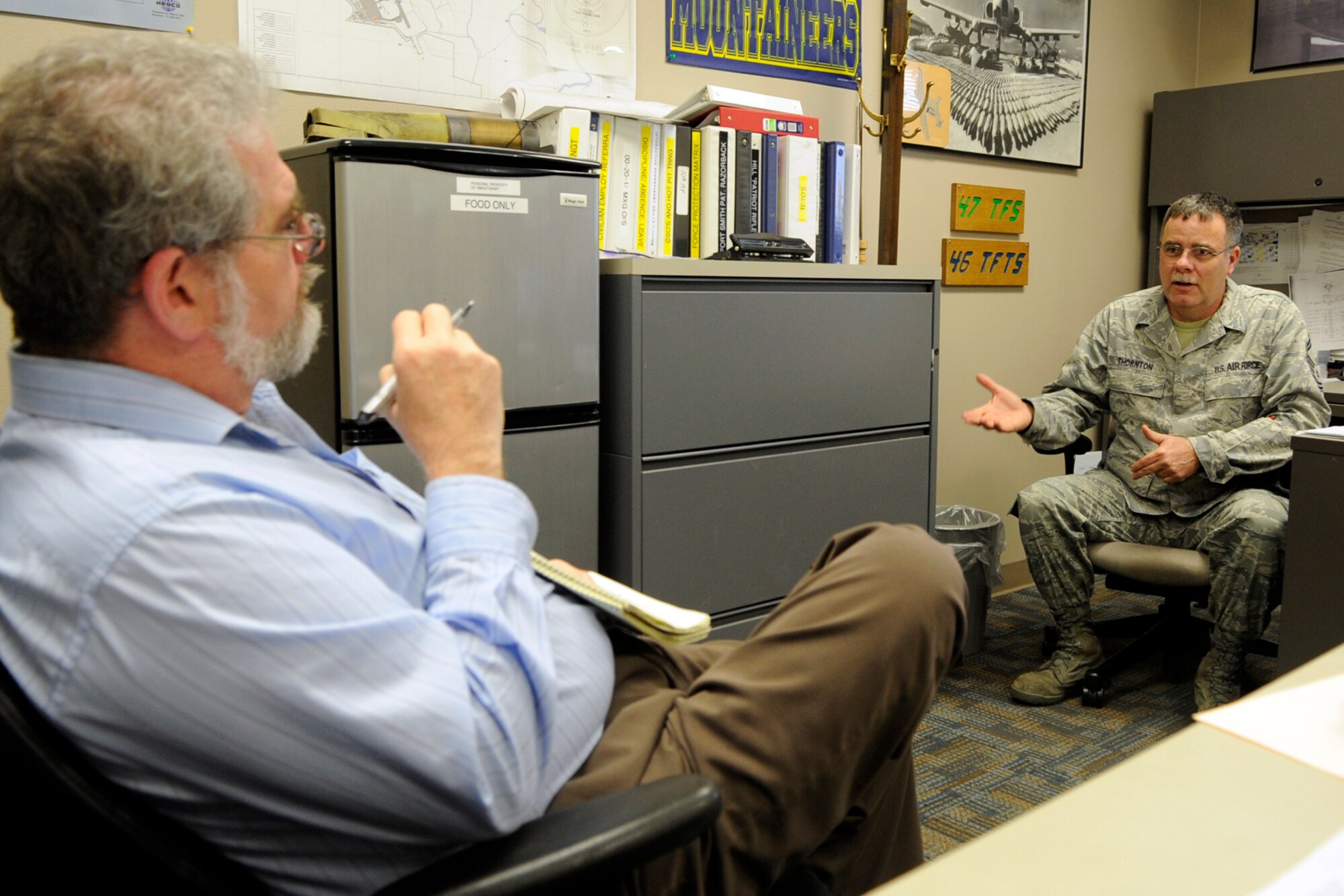 John Andrew Prime, who is the military editor for the Shreveport Times, discusses the future of Barksdale’s Reserve Airmen assigned to the 917th Fighter Group, with Senior Master Sgt. Mike Thornton at Barksdale Air Force Base, La., Feb. 13, 2013. Thornton is a production superintendent for the 917th Aircraft Maintenance Squadron. The 917 FG is scheduled to be inactivated in 2013, with many of its people transferring to other military bases and locations across the country. (U.S. Air Force photo by Master Sgt. Jeff Walston) 
