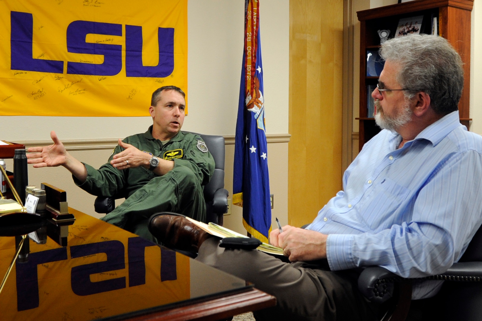 U.S. Air Force Col. John Breazeale, who is the commander of the 917th Fighter Group, interviews with Shreveport Times Military Editor John Andrew Prime, at Barksdale Air Force Base, La., Feb. 13, 2013. The two men discussed the future of Reserve Airmen assigned to the 917 FG and 47th Fighter Squadron, which are both scheduled to be inactivated in 2013. Prime, who has a personal interest in the historical aspect of the 47 FS, feels a sense of personal loss about the closure. His father was assigned to the 47 FS on Dec. 7, 1941, when Pearl Harbor was attacked by Japanese forces. (U.S. Air Force photo by Master Sgt. Jeff Walston) 