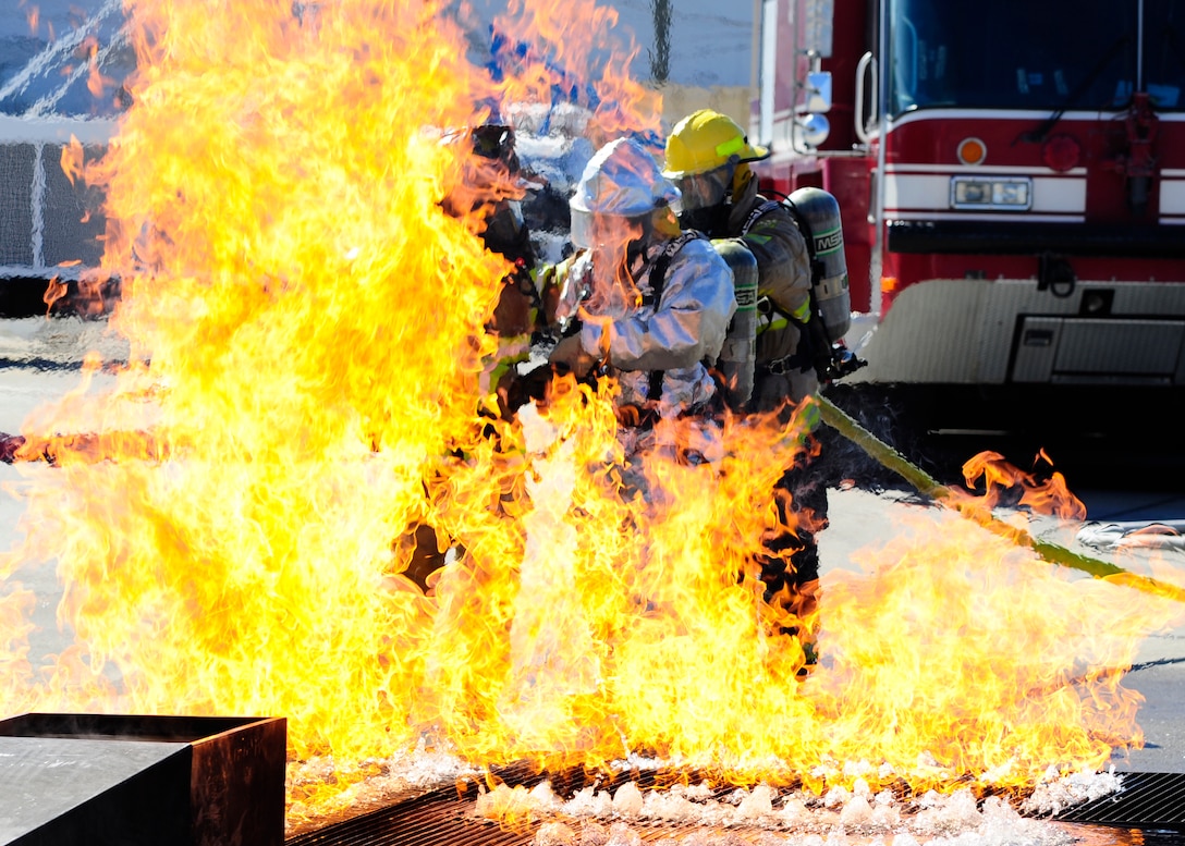 Mr. Herberth Gaekel, 612 th Air Base Squadron Fire Department fire inspector, instructs Honduran and Belize Fire Fighters through a simulated fuel fire during a four-day Central America Sharing Mutual Operational Knowledge and Experiences, CENTAM SMOKE exercise here, Feb. 13, 2013.  The four-day CENTAM SMOKE allows U.S. and Central American firefighters a chance for team-building and training. (Air Force photo by Staff Sgt. Eric Donner)