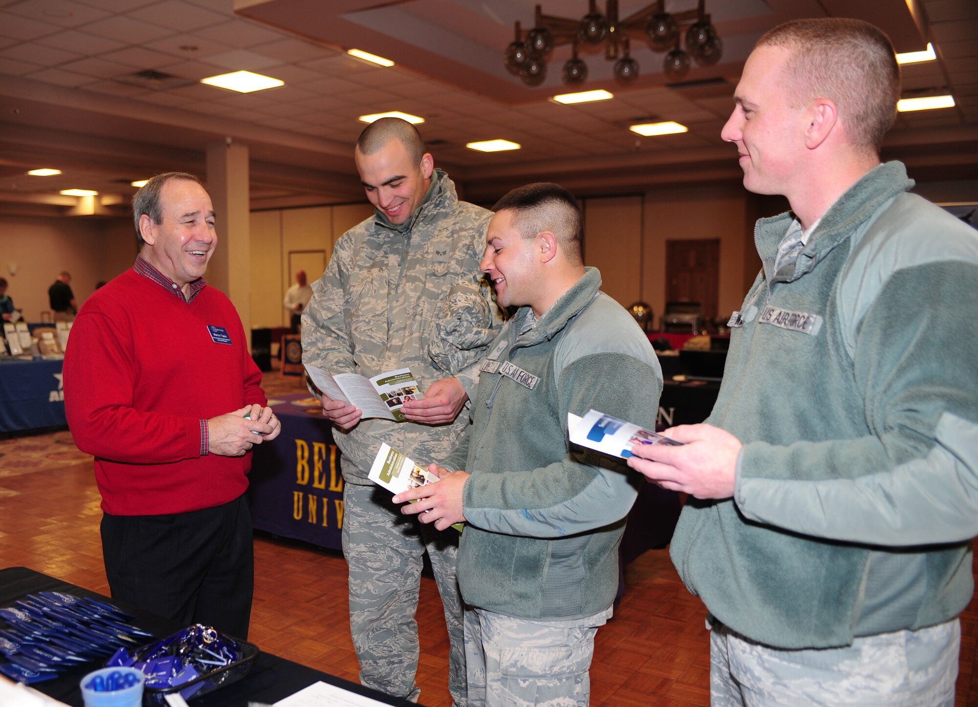 Marco Tapia, Columbia College of Missouri representative, gives programs to interested military members at the Education Expo in the Landing Zone at Cannon Air Force Base, N.M., Feb. 12, 2013. The expo included more than 20 schools and was designed to introduce education options to military members and their families. (U.S. Air Force photo/Airman 1st Class Ericka Engblom)
