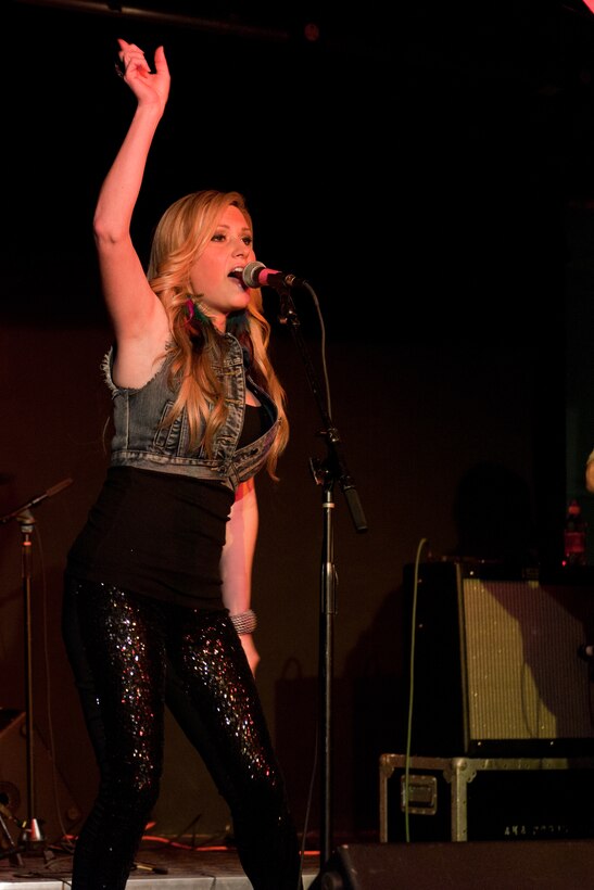 RAF ALCONBURY, United Kingdom - Country and western singer Ali Dee performed a free concert at RAF Alconbury Feb. 12. Dee also performed a free concert at RAF Croughton Feb. 11, which was her most memorable performance. “We were dancing up a storm all night at RAF Croughton,” said Dee. “I mean the children were dancing up on stage with me or on their dance floor - it was really fun.” (U.S. Air Force photo by Staff Sgt. Brian Stives)