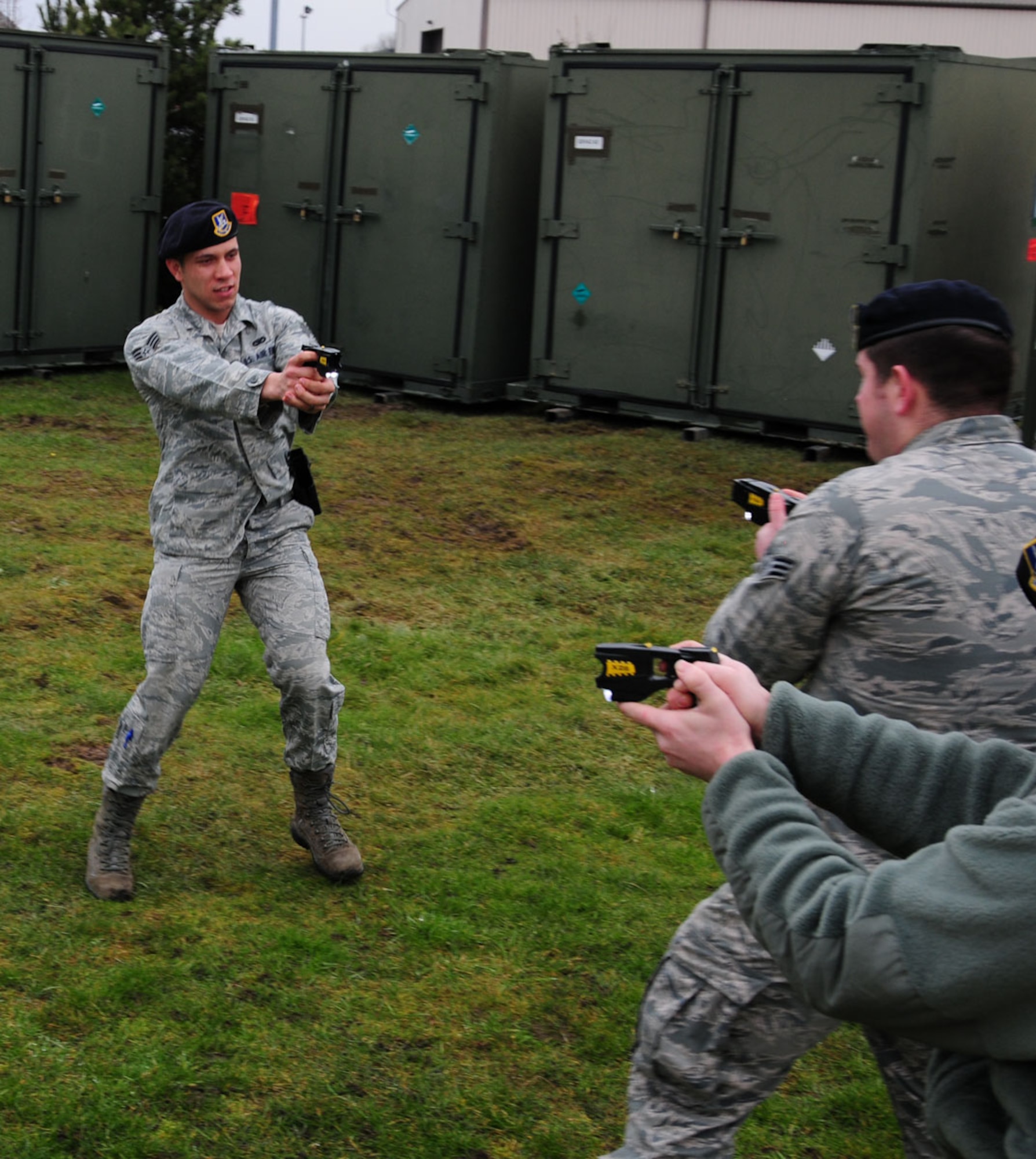 Airmen from the 100th Security Forces Squadron practice using Tasers on each other during a training session Feb. 11, 2013, at building 632, RAF Mildenhall, England. All 100th SFS Airmen, ranging from senior airman to technical sergeant, must train to a certain standard in order to meet legal requirements and become certified to use the weapon. (U.S. Air Force photo by Karen Abeyasekere/Released)