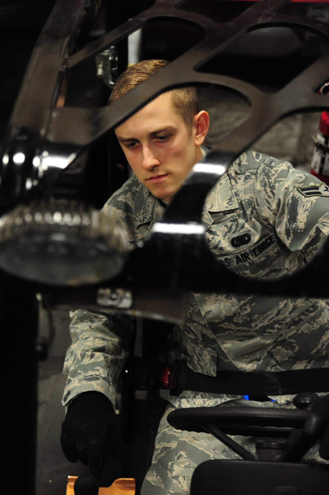 WHITEMAN AIR FORCE BASE, Mo. -- Airman 1st Class David Reddoch, 509th Logistics Readiness Squadron individual protective equipment technician, uses a fork lift to pull down chemical gear for an inventory inspection, Feb. 7. Airmen in the IPE shop are responsible for inspecting and maintaining thousands of IPE items in accordance with Air Force regulations. (U.S. Air Force photo/Staff Sgt. Nick Wilson) (Released)