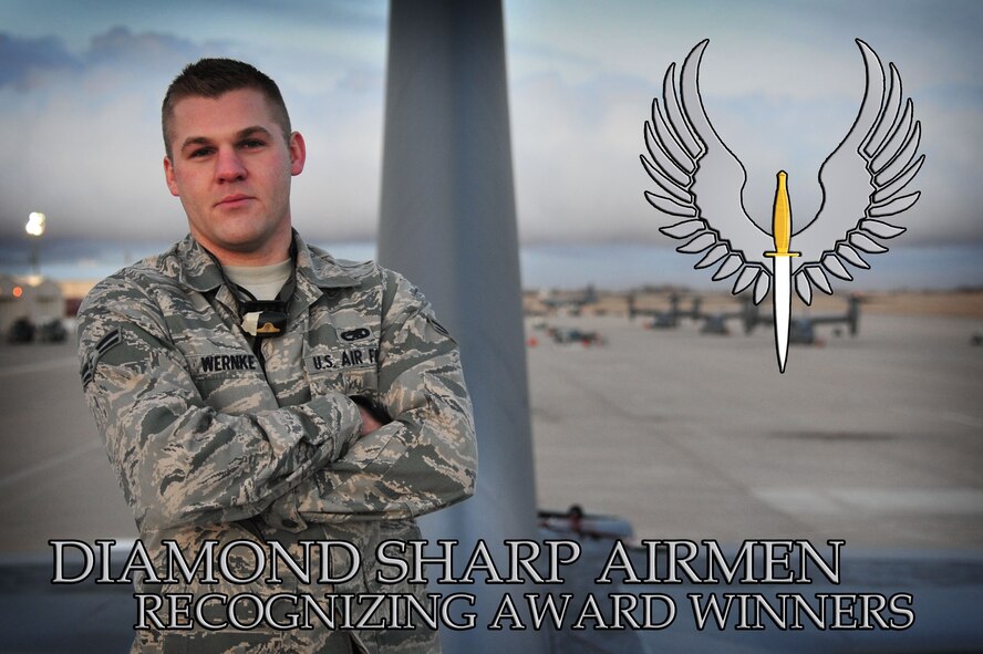 U.S. Air Force Airman 1st Class James Wernke, 27th Special Operations Maintenance Squadron electronic warfare systems technician, stands atop an AC-130H Spectre gunship for a photo on the flightline at Cannon Air Force Base, N.M., Jan. 29, 2013. Wernke is a recent Diamond Sharp award recipient who was recently recognized by wing leadership and first sergeants for his hard work and achievements. (U.S. Air Force photo/Senior Airman Alexxis Pons Abascal) 