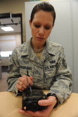 WHITEMAN AIR FORCE BASE, Mo. -- Tech. Sgt. Jessica Hildebrand, 509th Communications Squadron Wing Information Assurance Office NCOIC, operates a simple key loader, Feb. 11. The SKL is used to secure communications. (U.S. Air Force photo/Airman 1st Class Bryan Crane)