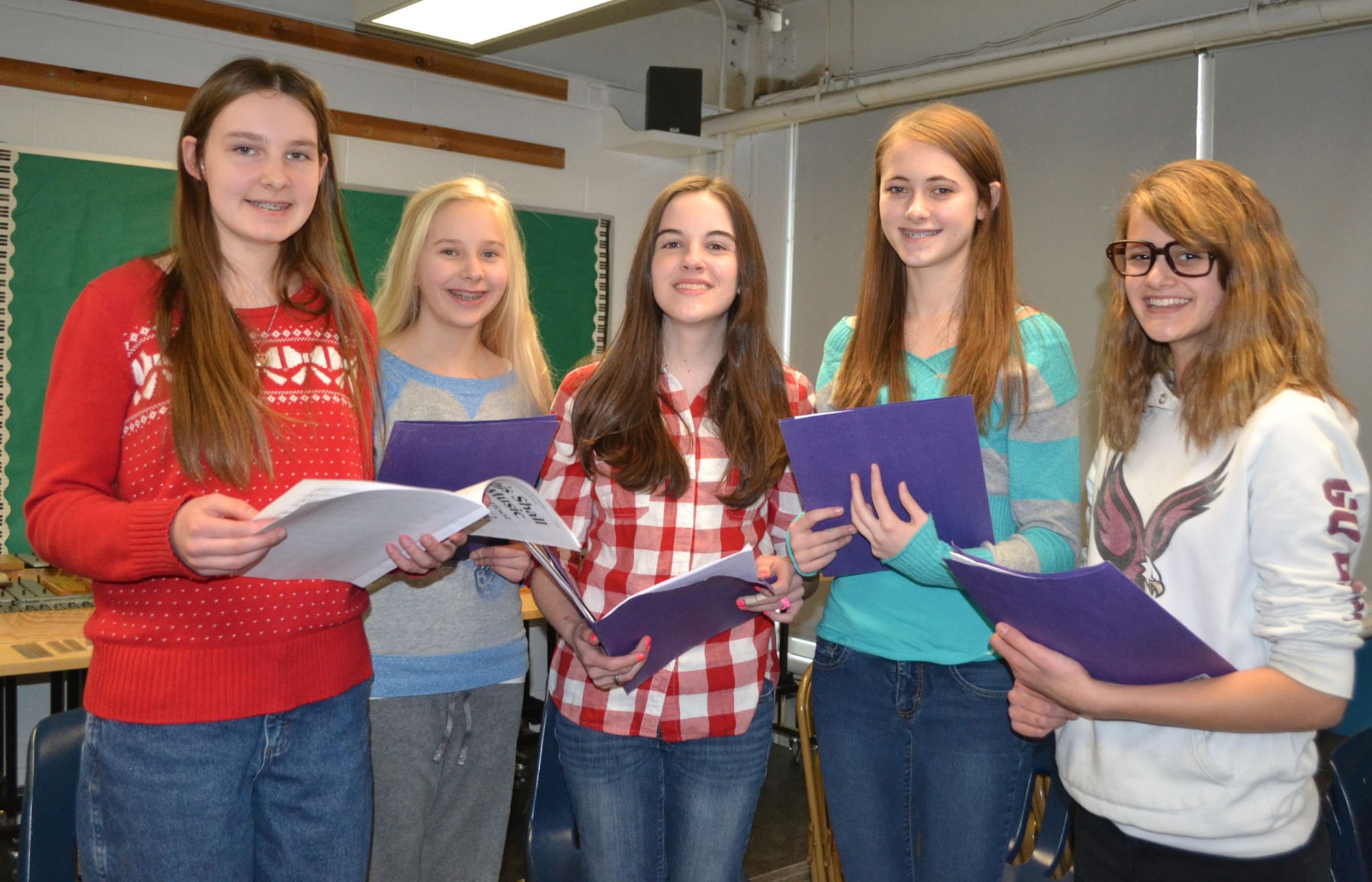 HANSCOM AIR FORCE BASE, Mass. – (left to right) Taylor Campbell, Emily McSwain, Katelyn Miller, Julianna Byington and Rebecca McIllece practice singing during a recent rehearsal at Hanscom Middle School. The five students were selected to participate in the Massachusetts Music Educators Association Eastern District Junior Festival on March 8 and 9. During auditions in January, 1,026 students from eastern Massachusetts performed. Of those, 476 were chosen for the festival. Byington and Campbell will sing with the Treble Chorus and McIllece, McSwain and Miller will sing with the Mixed Chorus. (Courtesy photo)