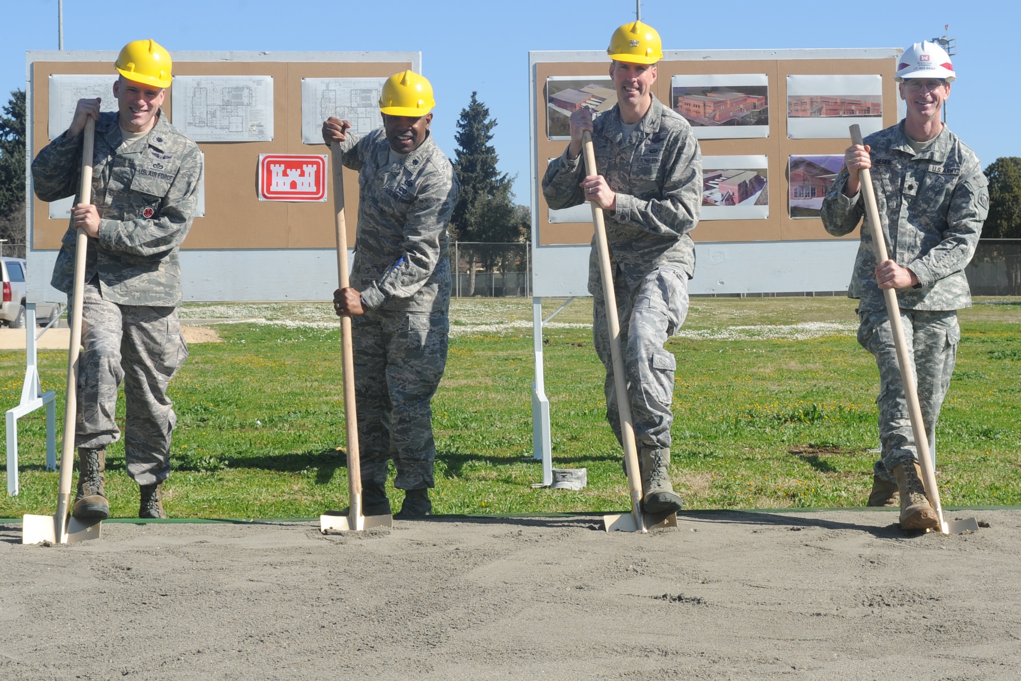 Lt. Col. John Sevier, 39th Civil Engineer Squadron commander, Lt. Col. Lawrence Hicks, 39th Mission Support Group deputy commander, Col. Chris Craige, 39th Air Base Wing commander, and Lt. Col. Rick Rieger, United States Army Corps of Engineers Europe District, plant their shovels into a section of dirt for the groundbreaking ceremony of the Consolidated Community Center Feb. 13, 2013, at Incirlik Air Base. The Consolidated Community Center, scheduled to open in the fall of 2014, will consolidate five base facilities that will provide multiple functions for Airmen and their families from both the U.S. and Turkey. (U.S. Air Force photo by Staff Sgt. Eric Summers Jr. / Released)