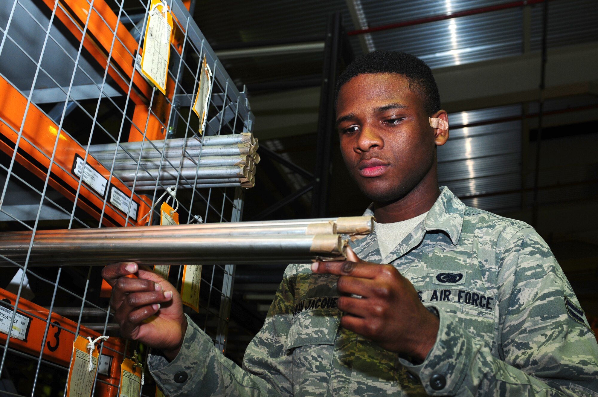 ROYAL AIR FORCE LAKENHEATH, England -- Airman 1st Class Josue Jean Jacques, 48th Logistics Readiness Squadron storage and issue apprentice, inspects a piece of equipment before delivering it Feb. 13, 2013. Jean Jacques was nominated for a Liberty Spotlight, because he displays the core value of "Excellence in All We Do." (U.S. Air Force photo by Airman 1st Class Dana J. Butler) 