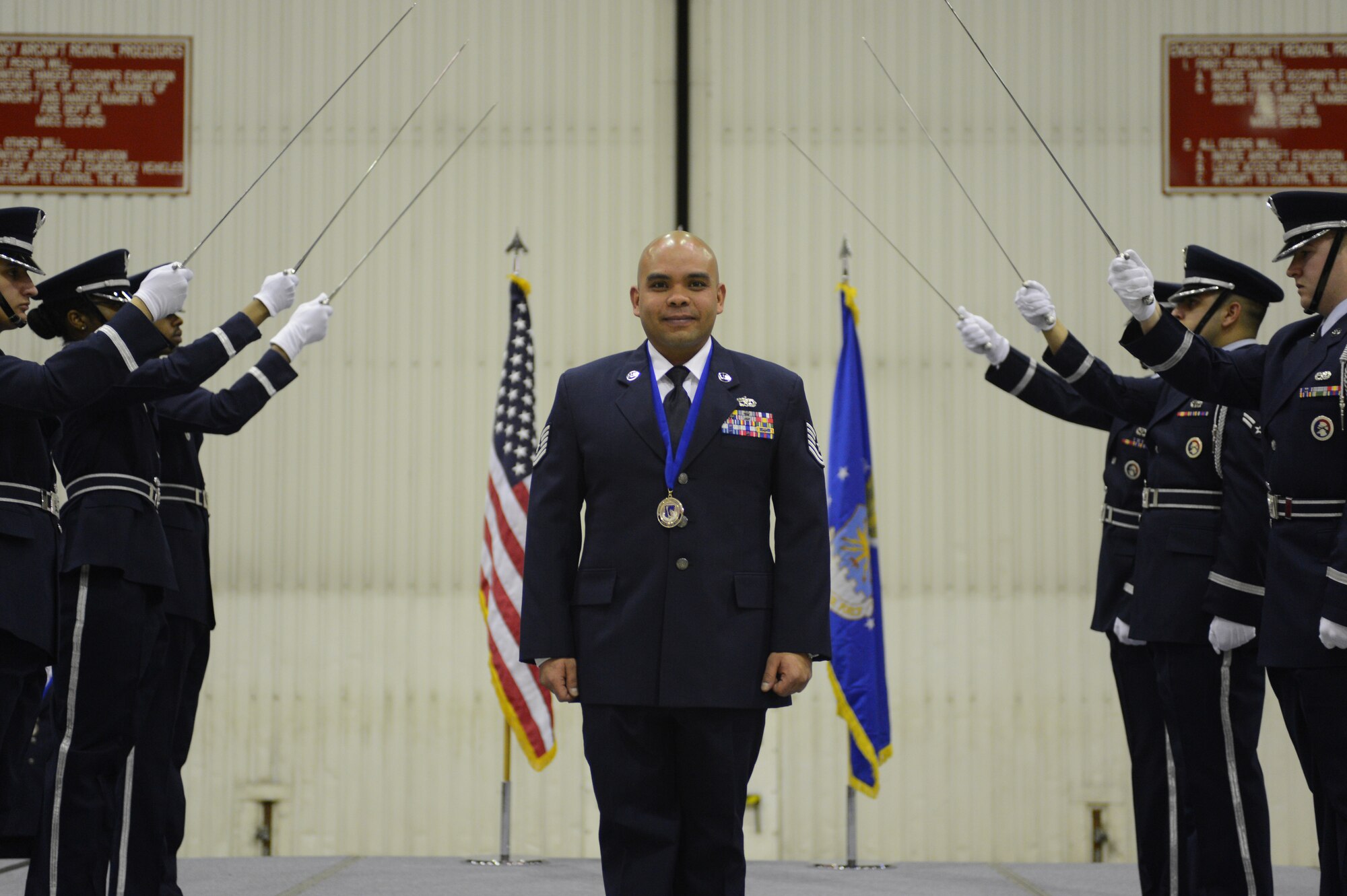 ROYAL AIR FORCE LAKENHEATH, England -- Tech. Sgt. Michael Kumiyama, 48th Equipment Maintenance Squadron aerospace ground equipment craftsman and winner of the Military Volunteer of the Year Award, pauses to be recognized during the 48th Fighter Wing Annual Awards Banquet at Hangar 7 Feb. 9, 2013. (U.S. Air Force photo by Airman 1st Class Dana J. Butler)
