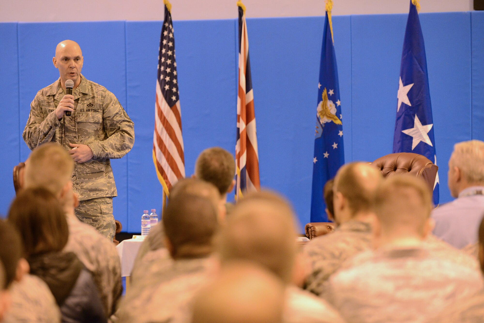 RAF CROUGHTON, United Kingdom – Chief Master Sgt. Craig A. Adams, U.S. Air Forces in Europe and Air Forces Africa command chief, Gen. Philip M. Breedlove, U.S. Air Forces in Europe and U.S. Air Forces Africa commander, gives an all-call at RAF Croughton Feb. 6 during his tour of the 501st Combat Support Wing. During the all-call, Gen. Philip M. Breedlove, USAFE/AFAFRICA commander, and chief focused on three key areas: Mission, Airmen and Families. (U.S. Air Force photo by Tech. Sgt. Chrissy Best)