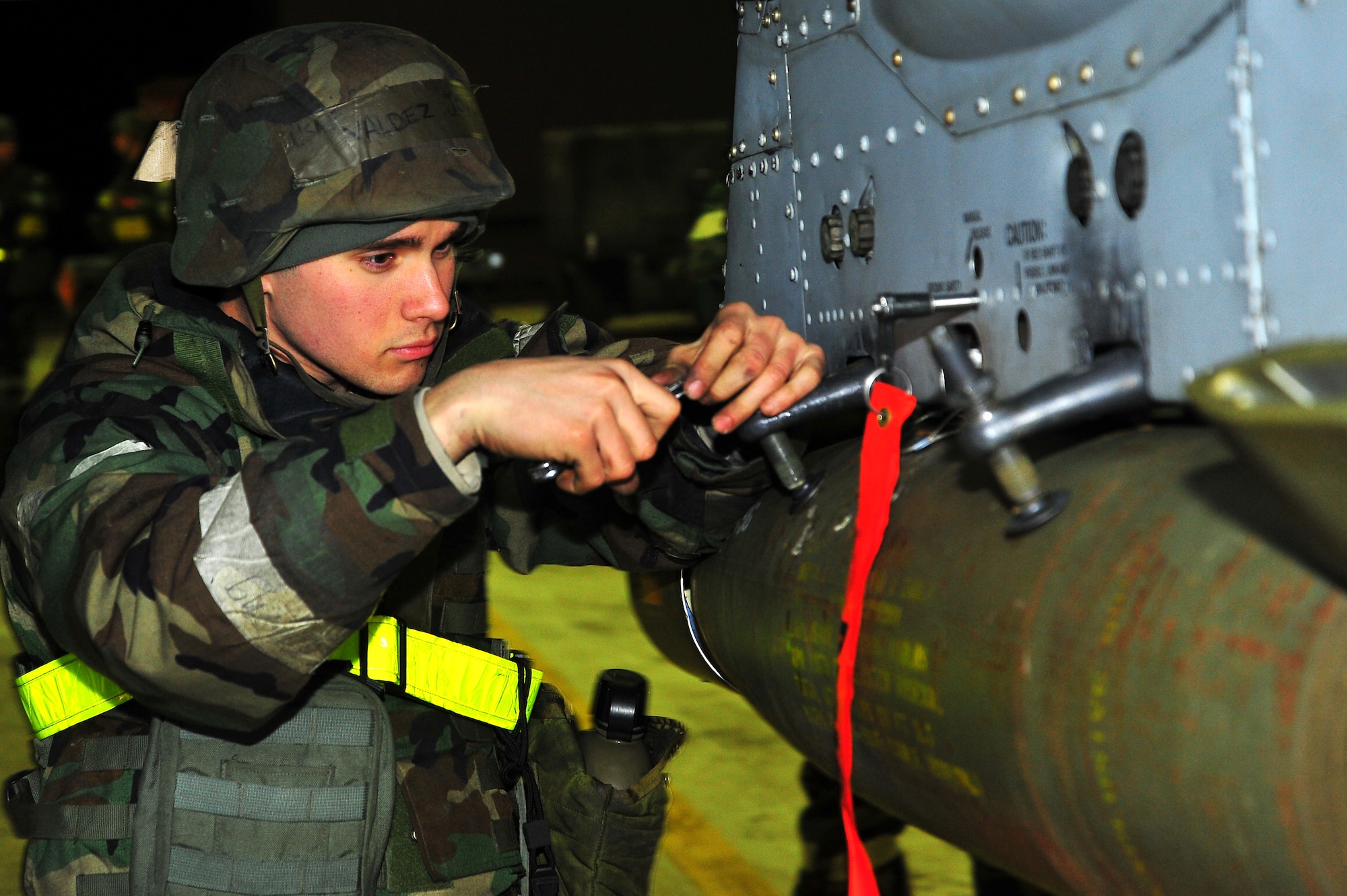 Senior Airman Joel Valdez, 51st Maintenance Operation Squadron lead crew member, loads a missile onto an A-10 Thunderbolt II at the flight line on Osan Air Base, Republic of Korea, Feb.13, 2013.  The exercise tests Osan Airmen’s abilities during a heightened state of readiness while providing combat ready forces for close air support, air strike control, counter air, interdiction, theater airlift, and communications in the defense of the Republic of Korea.  (U.S. Air Force photo/Staff Sgt. Emerson Nuñez)