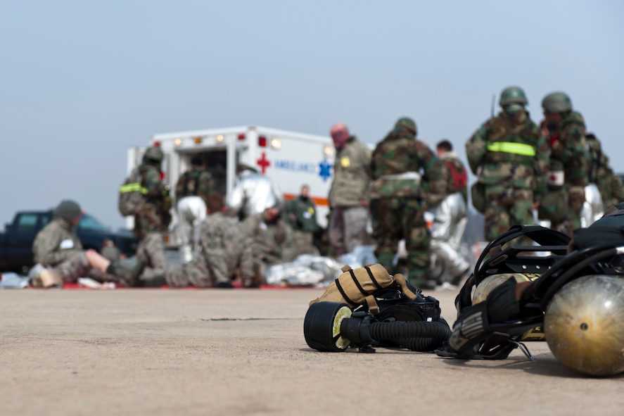 Airmen from the 8th Fighter Wing Fire Department, Emergency Services and Republic of Korea air force perform lifesaving care to 10 individuals during exercise Beverly Bulldog 13-2 at Kunsan Air Base, Republic of Korea, Feb. 14, 2013. Many of the simulated injured Airmen were treated on the spot, while others were transported to the clinic for further evaluation and treatment.(U.S. Air Force photo by Tech. Sgt. Michael Schocker/Released)