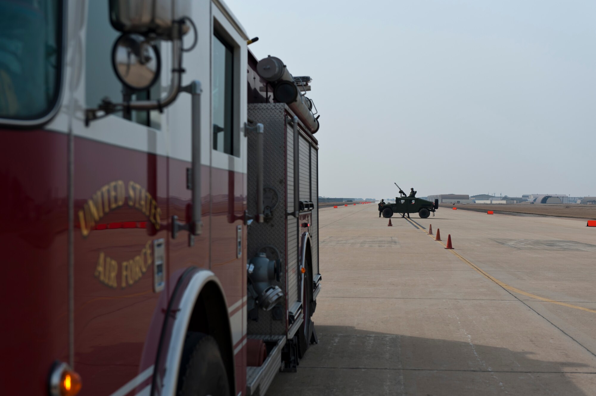 Airmen from the 8th Security Forces Squadron provide security for first responders during exercise Beverly Bulldog 13-2 at Kunsan Air Base, Republic of Korea, Feb. 14, 2013. They provided security for 20 emergency responders giving lifesaving care to the 10 injured individuals. (U.S. Air Force photo by Tech. Sgt. Michael Schocker/Released)
