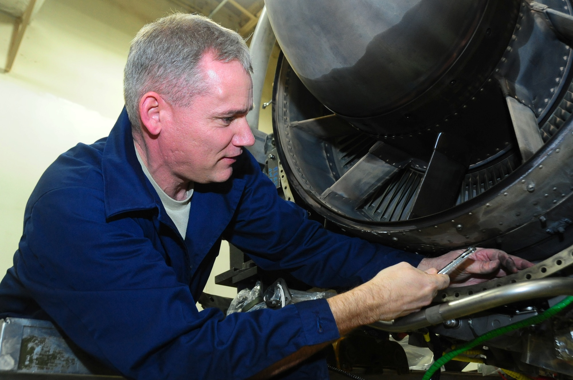 U.S. Air Force Chief Master Sgt. James Laurent, 35th Fighter Wing command chief, works on a major assembly low pressure turbine during the Dirty Job Program at the 35th Maintenance Squadron on Misawa Air Base, Japan, Feb. 13, 2013.  The program gives the squadron’s technical experts a chance to train wing leadership in the specifics of their career field.  (U.S. Air Force photo by Staff Sgt. April Quintanilla)