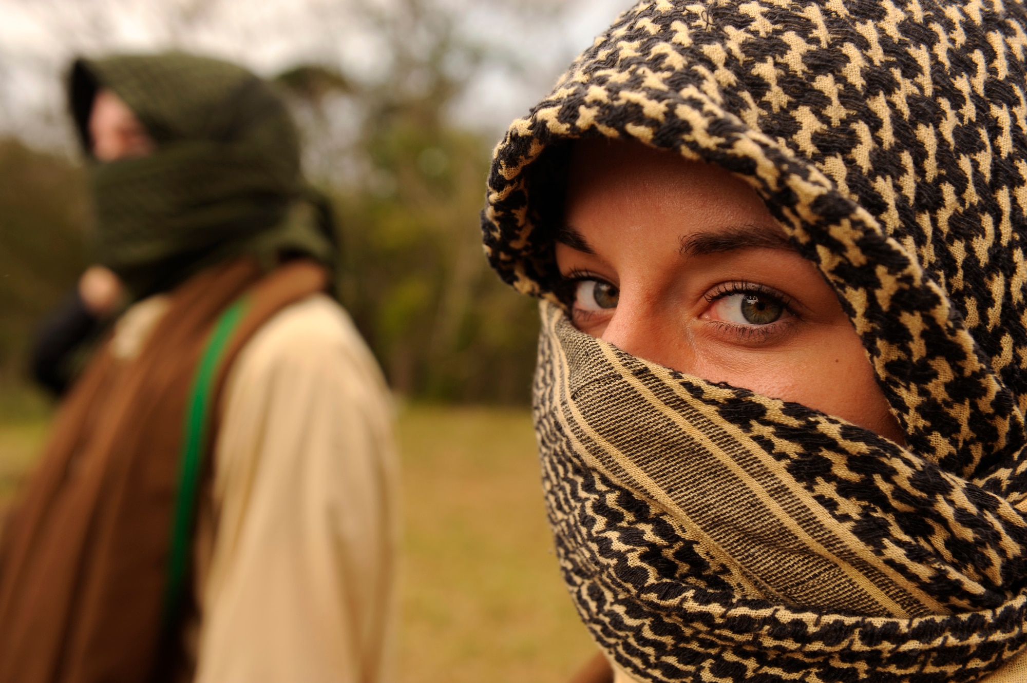 U.S. Air Force Airman 1st Class Angela Hegler, 18th Comptroller Squadron customer service technician, dresses up as a Middle Eastern civilian during a war week exercise at Marine Corps Camp Hansen's Combat Town, Japan, Feb. 7, 2013. During the exercise, members from the 31st and 33rd RQSs practiced a multitude of scenarios, including extraction under fire, convoy attacks and aircraft incidents. (U.S. Air Force photo/Senior Airman Maeson L. Elleman)