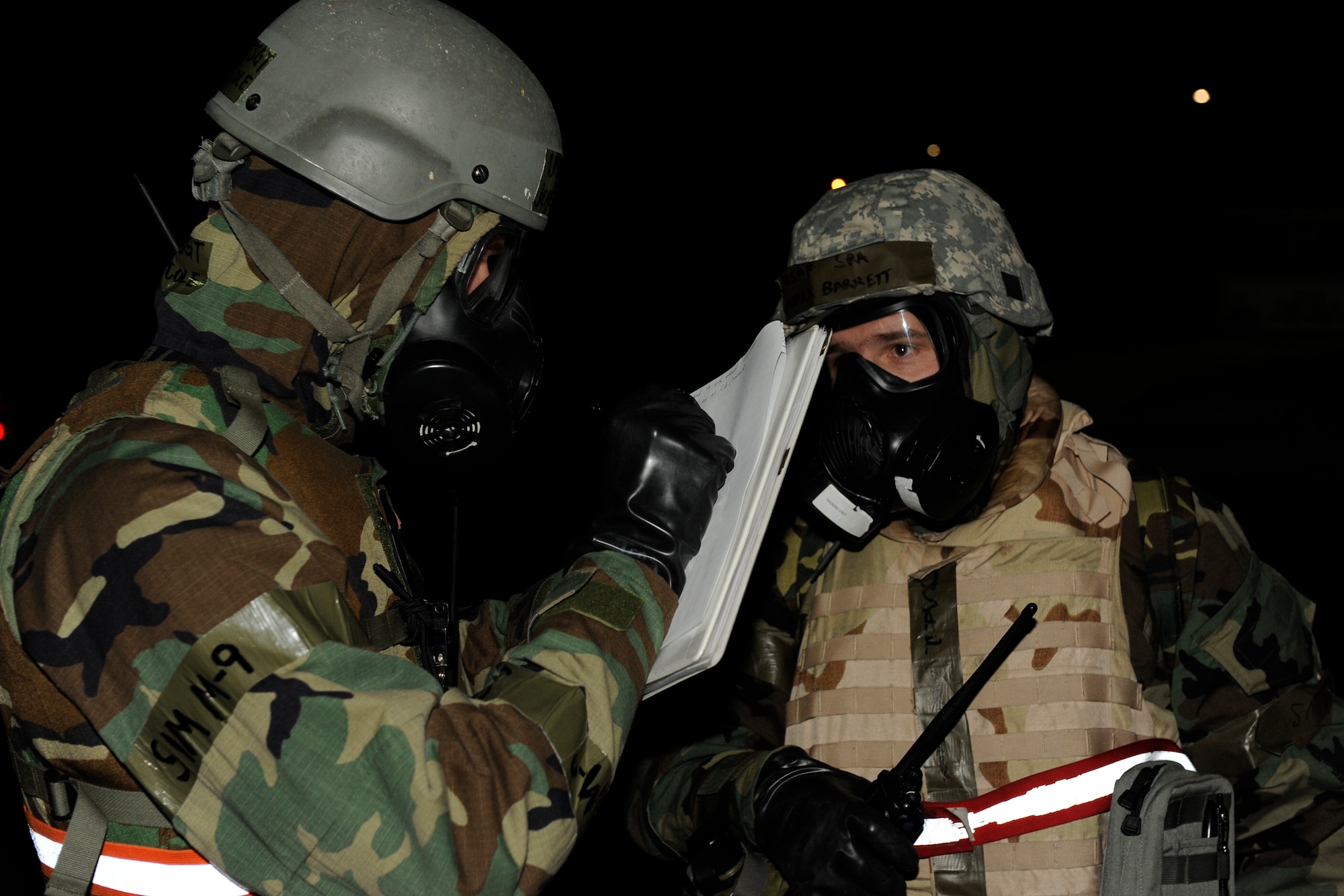 KUNSAN AIR BASE, Republic of Korea -- Tech. Sgt. Jeremy Cole, left, 8th Maintenance Operations Squadron exercise evaluation team, reviews Senior Airman Mark Barrett, 8th Maintenance Squadron, post-attack reconnaissance sweep during exercise Beverly Bulldog 13-2 at Kunsan Air Base, Republic of Korea, Feb. 14, 2013. Barrett and his teammate successfully discovered and called in unexploded ordnance after hearing a simulated mortar attack. (U.S. Air Force photo by Senior Airman Marcus Morris/Released)