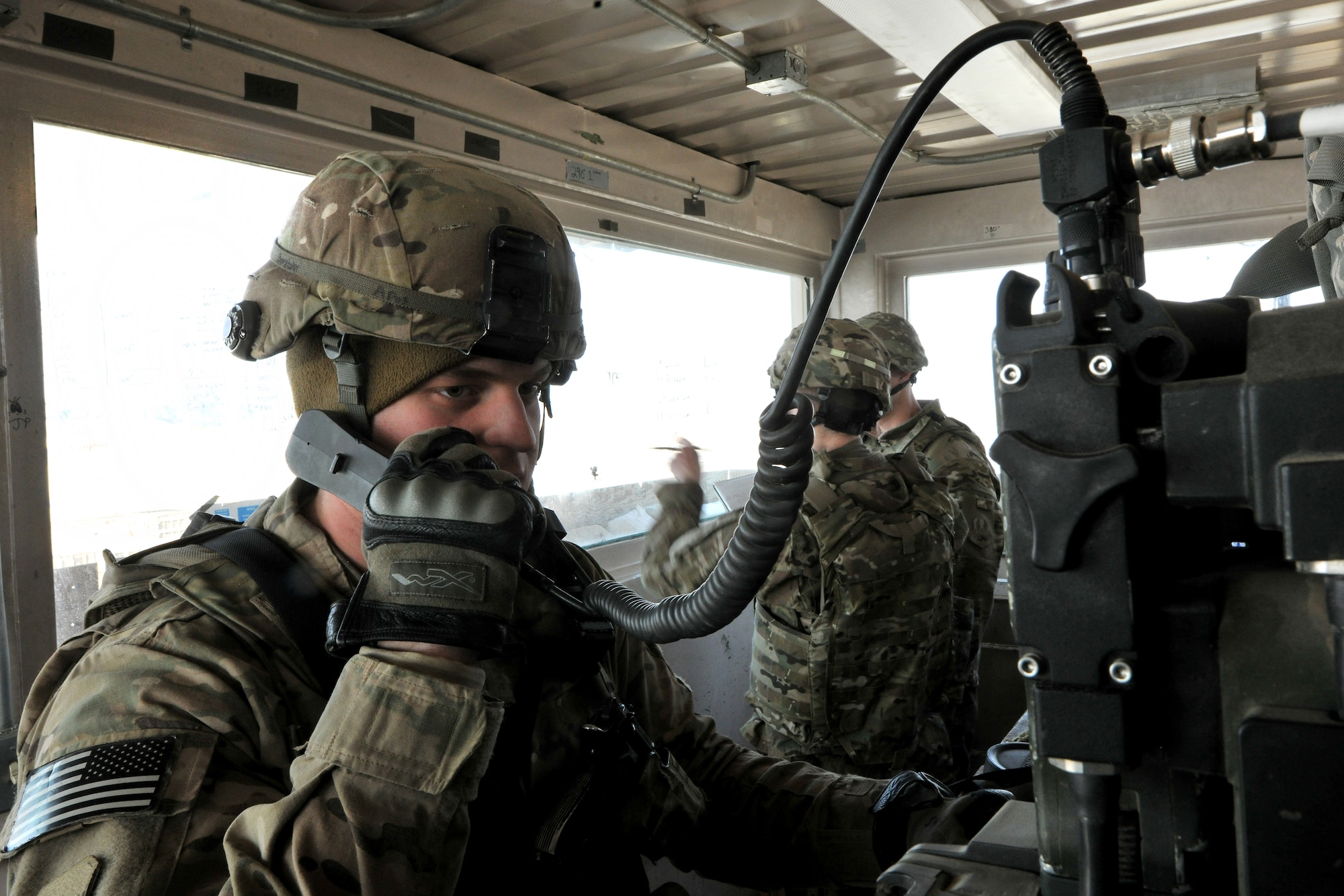 Airman 1st Class Lee Borytsky, 455th Expeditionary Security Forces Squadron defender, performs an operational radio check in a guard tower on Bagram Airfield, Afghanistan, Jan. 10, 2013. The 455th ESFS have multiple tools at their disposal, such as the ability to call in a linguist to speak to interlopers who stray too close to the perimeter. (U.S. Air Force photo/Senior Airman Chris Willis)