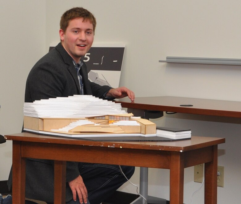 Allen Yoder, graduate student at the University of Miami-Ohio leaves the lights on in the model of an environmentally compatible building included in his design for a proposed marina at Lake Cumberland, Ky. Yoder and three other classmates prepared and submitted their designs to the U.S. Army Corps of Engineers Nashville District Dec. 3, 2012 in Nashville, Tenn., as part of a real-world class assignment.