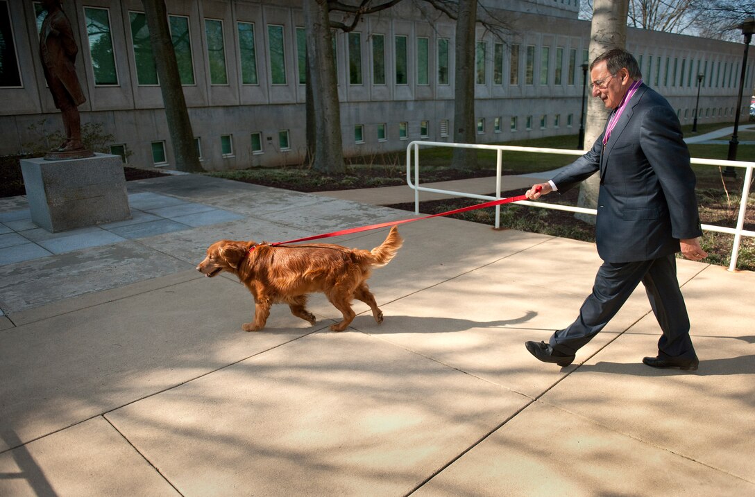 Defense Secretary Leon E. Panetta and his golden retriever, Bravo, visit the headquarters of the CIA in MacLean, Va., Feb. 14, 2013. Panetta is preparing to retire but will remain secretary of defense until his successor is confirmed and sworn in.