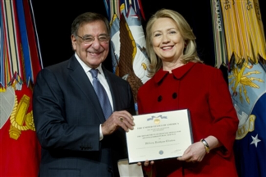 Secretary of Defense Leon E. Panetta presents former Secretary of State Hillary Rodham Clinton with the Department of Defense Medal for Distinguished Public Service during a ceremony in the Pentagon on Feb. 14, 2013.  