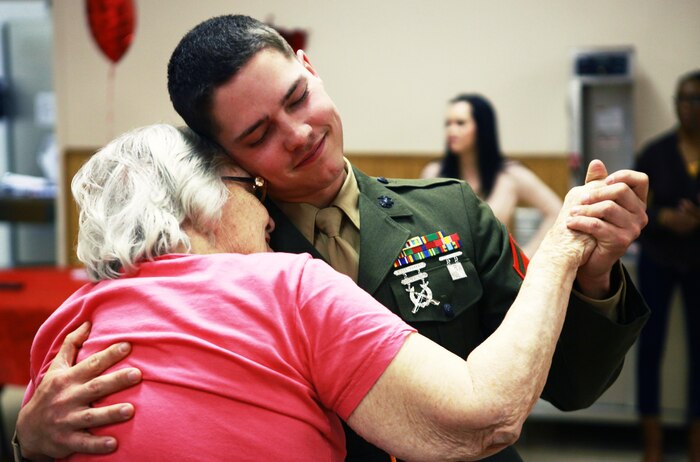 Lance Cpl. Matthew S. Hartlove, a Baltimore native and electrician with 2nd Supply Battalion, 2nd Marine Logistics Group, dances with a resident of Carebridge Assisted Living center in Jacksonville, N.C., Feb. 12, 2013. The facility hosted a Sweetheart Dance and invited Marines from various units to dance, sing, eat and socialize with the residents. 