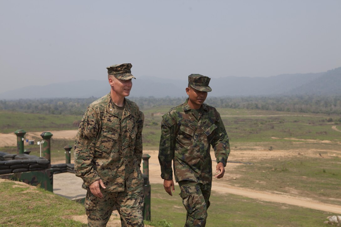 U.S. Marine Lt. Col. Chris P. O'Connor (left) and Royal Thai Marine Lt. Cmdr. Banjerd Adium depart the formation of Thai and U.S. Marines after the conclusion of the opening ceremony Feb. 11 announcing the start of exercise Cobra Gold 2013 field training exercises at Ban Chan Krem, Kingdom of Thailand. Cobra Gold is a recurring, multinational and multiservice exercise hosted annually by Thailand and developed by the Thai and U.S. militaries. CG 13 also includes humanitarian and civic assistance projects and a staff exercise. Adium is the commanding officer of 3rd Battalion, 1st Infantry, Royal Thai Marines, and O'Connor is the commanding officer of 1st Battalion, 3rd Marine Regiment, 3rd Marine Division, III Marine Expeditionary Force.