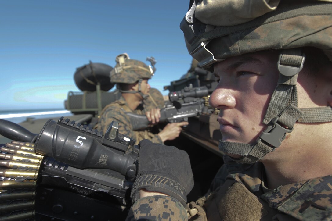 130213-M-IO267-131
MARINE CORPS BASE CAMP PENDLETON, Calif. – U.S. Marine Corps Pfc. Josh Barnett, a machine gunner with Bravo Company, 1st Battalion, 4th Marine Regiment, 13th Marine Expeditionary Unit, provides security on an amphibious assault vehicle 7 during Exercise Iron Fist 2013, aboard Marine Corps Base Camp Pendleton, Calif., Feb. 13, 2013. During Exercise Iron Fist 2013, the 13th MEU and Japan Ground Self Defense Force spent three weeks participating in bilateral training which improved their interoperability, enhanced military-to-military relations, and sharpened skills essential to crisis response. (U.S. Marine Corps photo by Lance Cpl. David Gonzalez/released)
 
