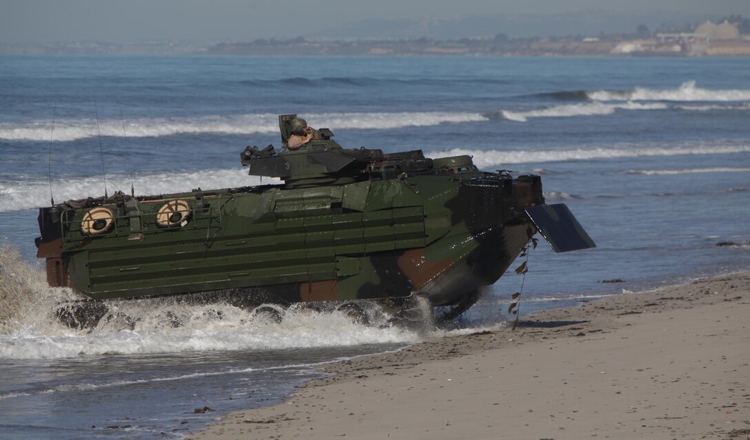 130213-M-OHO54-481
MARINE CORPS BASE CAMP PENDLETON, Calif. – Marines with Amphibious Assault Vehicle Platoon, Bravo Company, 1st Battalion, 4th Marine Regiment, 13th Marine Expeditionary Unit, land their amphibious assault vehicle 7 as part of the final wave, during amphibious operations as part of Exercise Iron Fist 2013, aboard Marine Corps Base Camp Pendleton, Feb. 13, 2013. During Exercise Iron Fist, the 13th MEU and members of Japan Ground Self Defense Force spent three weeks participating in bilateral training which improved their interoperability, enhanced military-to-military relations, and sharpened skills essential to crisis response.  (U.S. Marine Corps photo by Sgt. Christopher O’Quin/Released)
