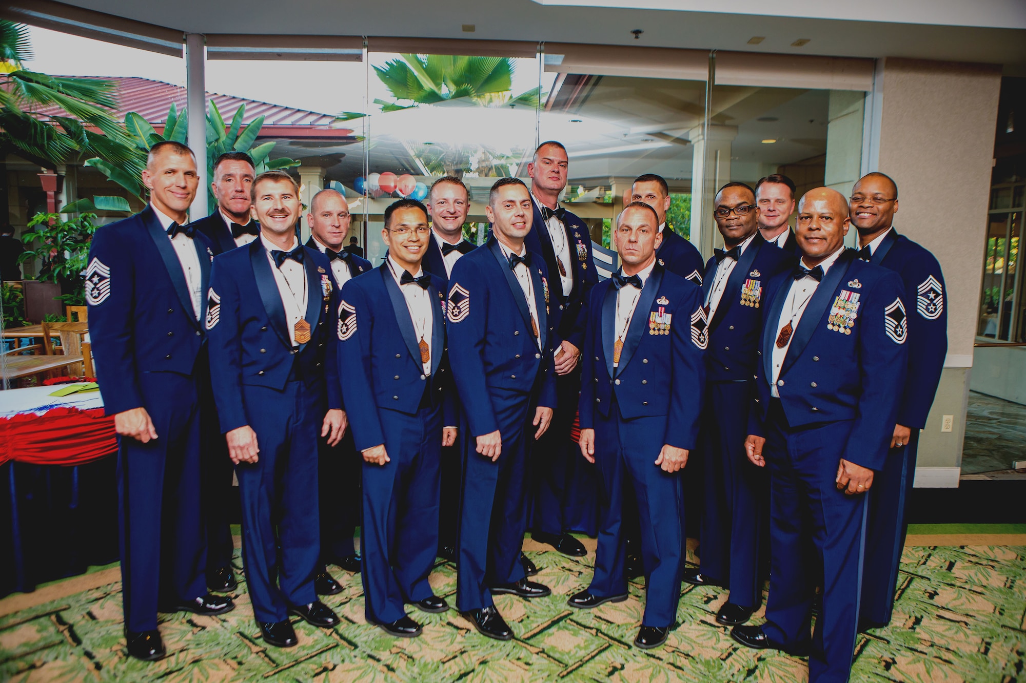 The newest chief master sergeant inductees stand with Pacific Air Forces Command Chief, Steve McDonald, who served as the guest speaker for the event, and Chief Master Sgt. Leslie Bramlett, 15th Wing command chief, at the induction ceremony held at the Tradewinds Enlisted Club on Joint Base Pearl Harbor-Hickam, Hawaii, Feb. 1. 