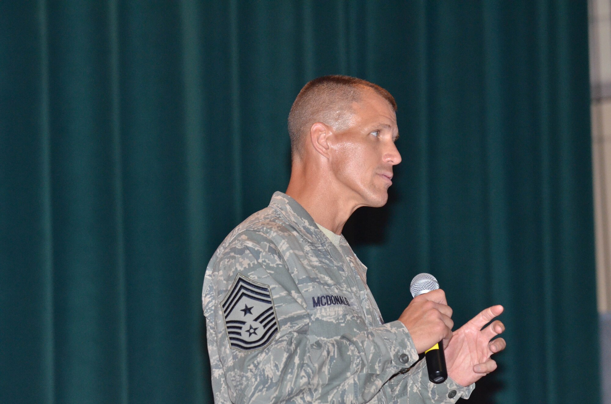 Pacific Air Forces Command Chief Master Sgt. Steve McDonald addresses Andersen Air Force Base’s enlisted force Feb. 12, 2013. He visited the base to learn about the mission and operations at Andersen and to speak to the Airmen and address their questions. (U.S. Air Force photo by Staff Sgt. Alex Montes/Released)