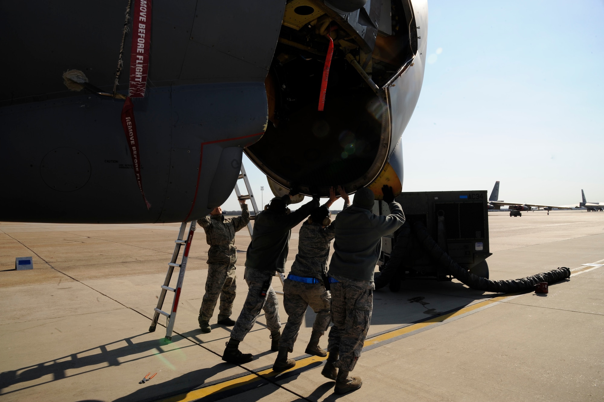 Airmen assigned to the 2nd Aircraft Maintenance Squadron lift the nose of a B-52H Stratofortress to access the radar on Barksdale Air Force Base, La., Feb. 15. The B-52s radar enables it to find and locate objectives for its mission of bringing precision munitions to the battlefield. (U.S. Air Force photo/Airman 1st Class Andrew Moua)
