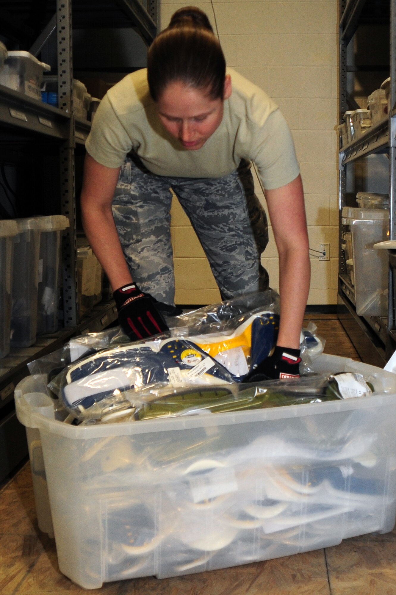 U.S. Air Force Staff Sgt. Emily Thein, 48th Rescue Squadron medical logistics technician, organizes the neck brace box at Davis-Monthan Air Force Base, Ariz., Feb. 13, 2013.Sergeant Thein is currently reorganizing the medical supply room. (U.S. Air Force photo by Airman 1st Class Camilla A Griffin/Released)