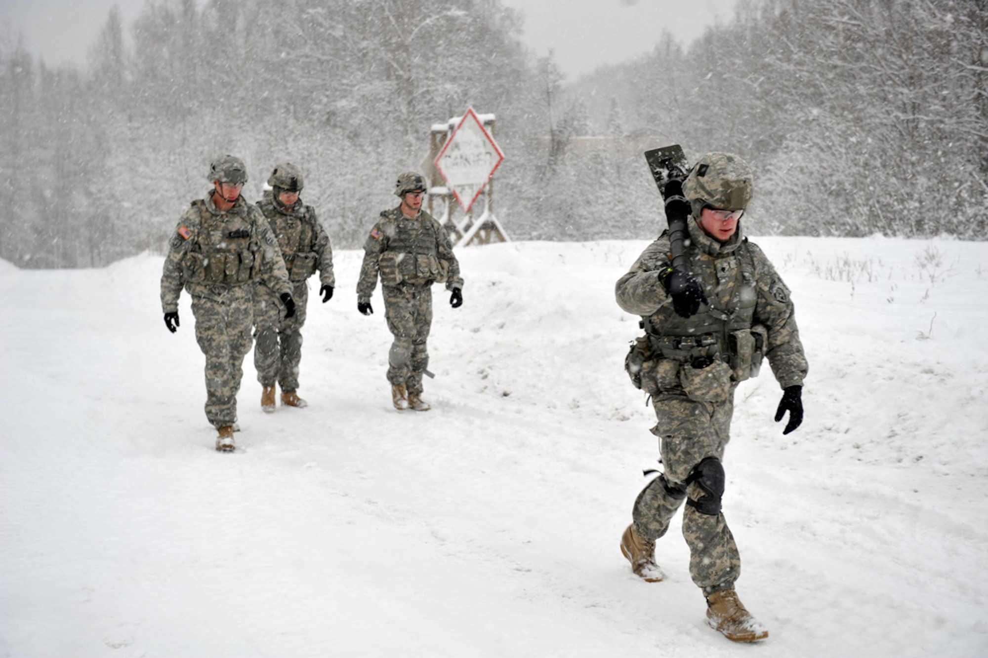 JOINT BASE ELMENDORF-RICHARDSON, Alaska -- Headquarters and Headquarters Company, 1st Battalion (Airborne), 501st Infantry Regiment mortarmen prepare for second phase mortar training at the Upper Cole Range Feb. 7. Mortar training is an Army field requirement that all infantry members must qualify for before being authorized to man them. (U.S. Air Force photo/Airman Ty-Rico Lea)