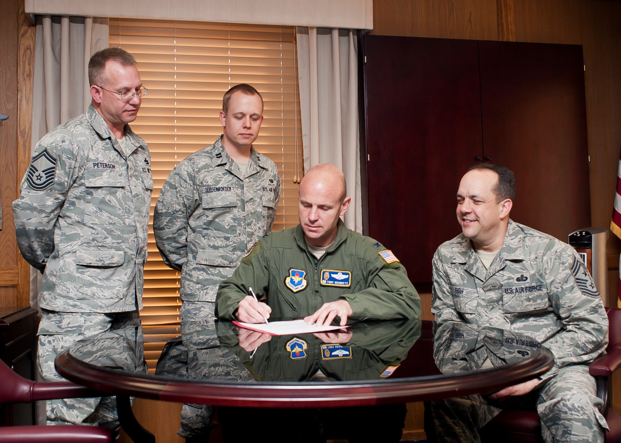 ALTUS AIR FORCE BASE, Okla. – Col. Anthony Krawietz, 97th Air Mobility Wing commander, signs a proclamation to kick off the Air Force Assistance Fund campaign, Feb. 14. The AFAF is an annual campaign to raise funds for charitable affiliates that provide support and emergency aid to Air Force families in need. The charities include the Air Force Aid Society, Air Force Enlisted Village, Air Force Village and the LeMay Foundation. Altus AFB's AFAF campaign will run from March 4 to April 12.  (U.S. Air Force photo by Airman 1st Class Levin Boland / released)