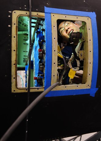 Ron Springer, Lockheed Martin aircraft structure mechanic, checks the inside of a cockpit of a U-2 intelligence, surveillance and reconnaissance aircraft, at Beale Air Force Base, Calif., Feb. 14, 2013. Lockheed mechanics are working on Cockpit Altitude Reduction Effort modifications to retrofit the older design of the U-2 cockpit for pilot safety. (U.S. Air Force photo by Senior Airman Shawn Nickel/Released)