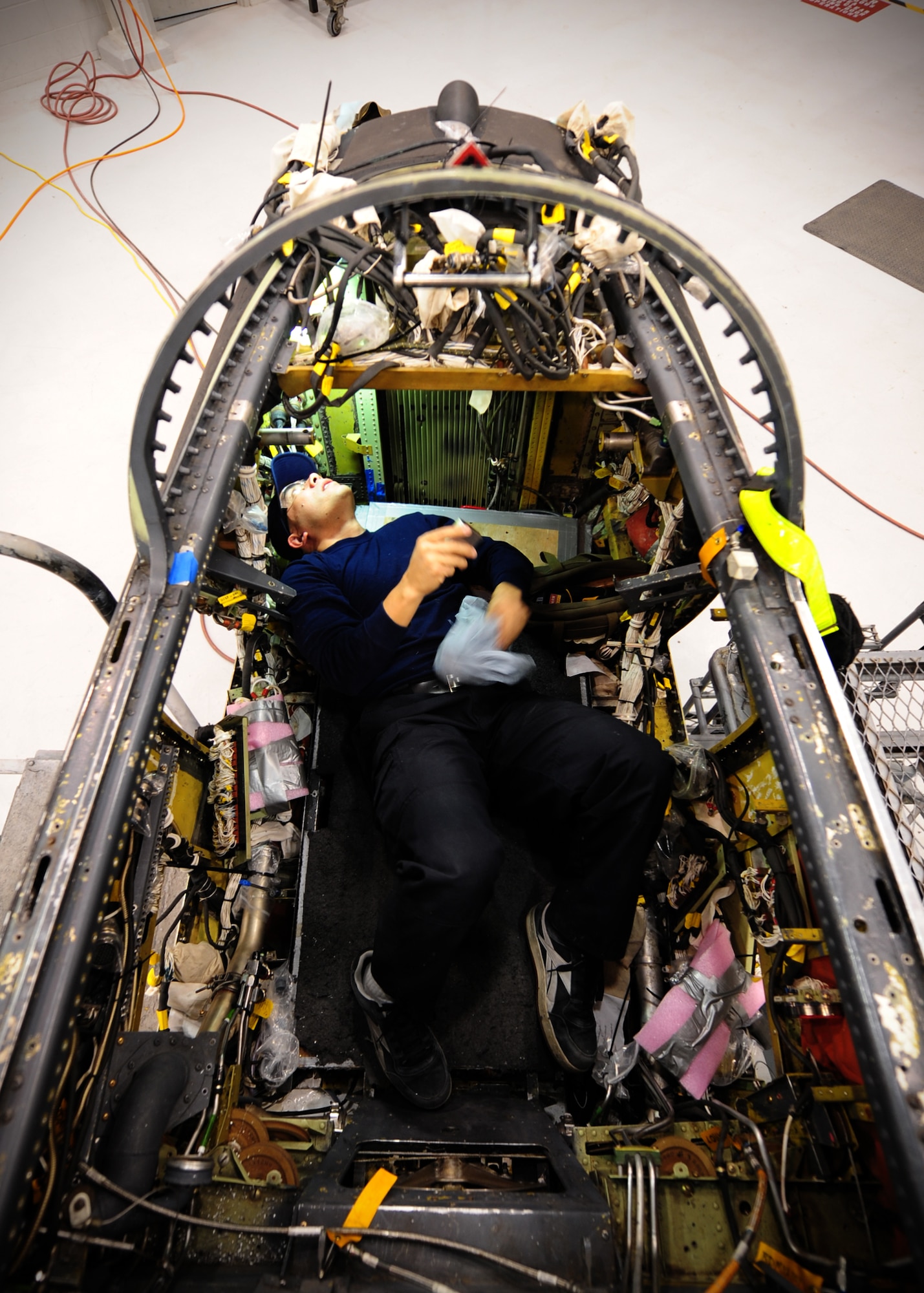 Ron Springer, Lockheed Martin aircraft structure mechanic, checks the inside of a cockpit of a U-2 intelligence, surveillance and reconnaissance aircraft, at Beale Air Force Base, Calif., Feb. 14, 2013. Lockheed mechanics are working on Cockpit Altitude Reduction Effort modifications to retrofit the older design of the U-2 cockpit for pilot safety. (U.S. Air Force photo by Senior Airman Shawn Nickel/Released)