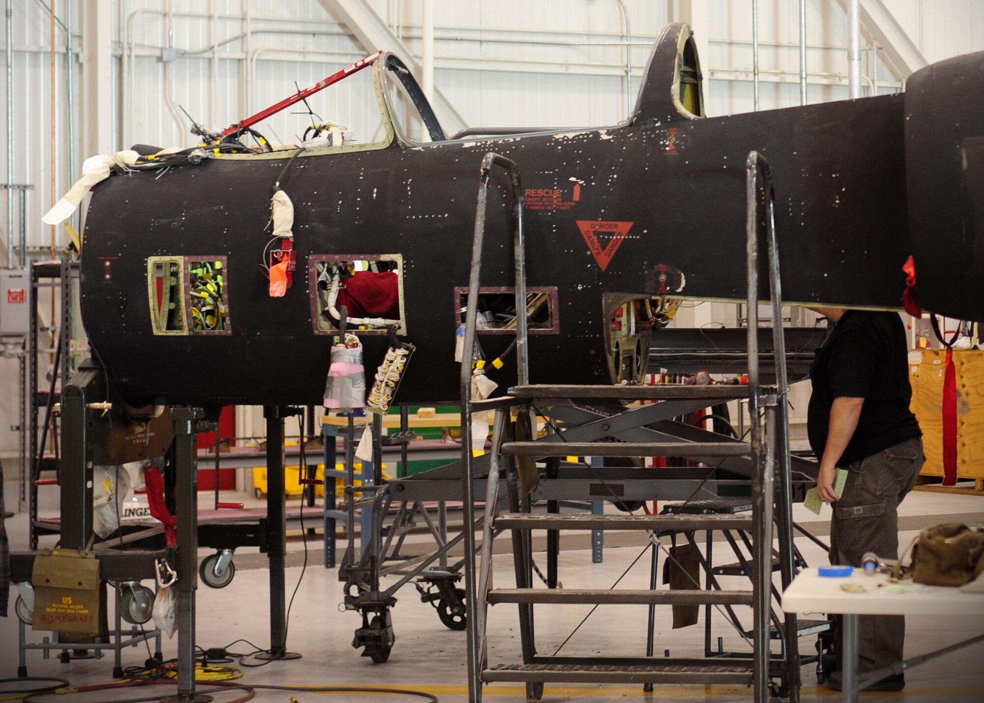 Jack Jackson, Lockheed Martin aircraft structure mechanic, checks rivets in the frame of a U-2 intelligence, surveillance and reconnaissance aircraft, at Beale Air Force Base, Calif., Feb. 14, 2013. Lockheed mechanics are working on Cockpit Altitude Reduction Effort modifications to retrofit the older design of the U-2 cockpit for pilot safety. (U.S. Air Force photo by Senior Airman Shawn Nickel/Released)
