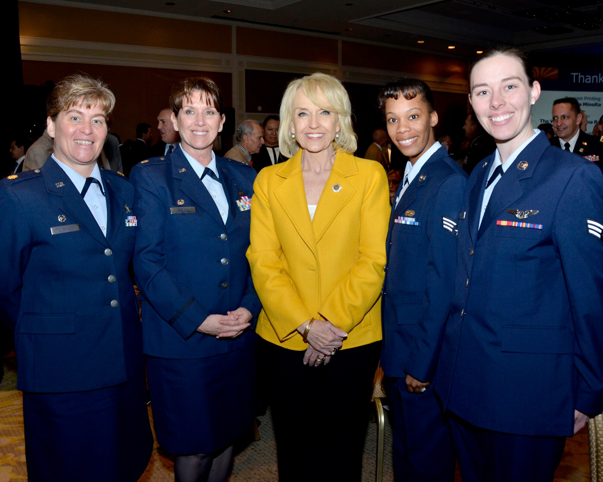 Arizona Governor Janet Brewer is flanked by members of the 162nd Fighter Wing (from left) Maj. Tracy Reingruber, Lt. Col. Patricia Wilson, and Senior Airmen Breona Calvert and Rachelle Perry after the State of the State address at the La Paloma Resort in Tucson, Ariz., Jan. 15. The four Airmen, representing the Arizona Air National Guard, were among many guests ranging from business executives to community leaders who attended the annual event.