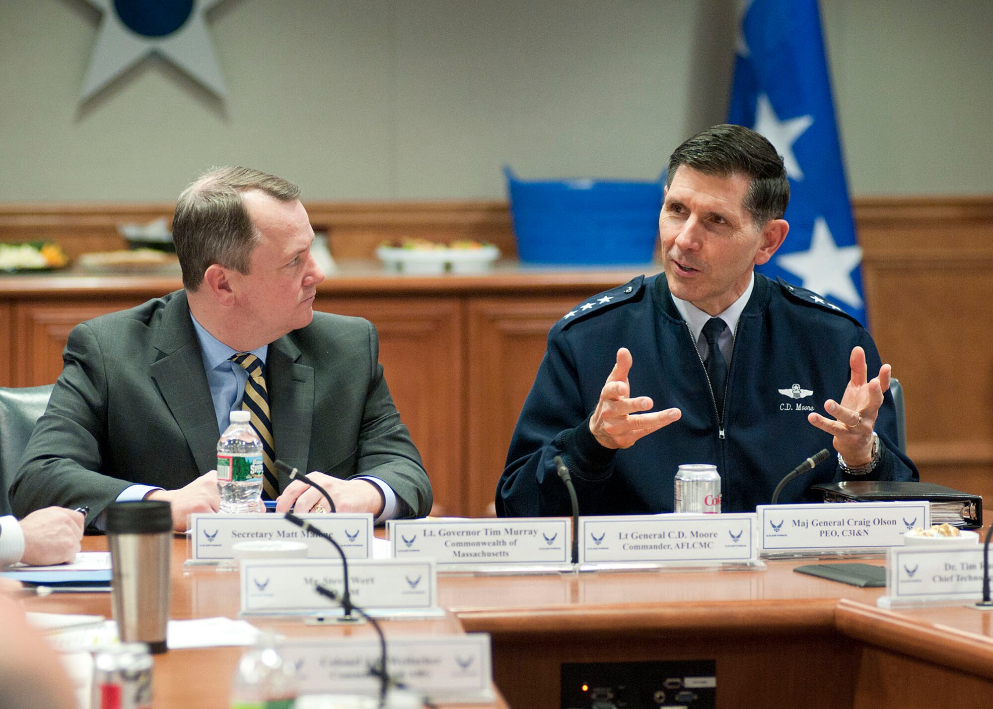 HANSCOM AIR FORCE BASE, Mass. -- Lt. Gen. C.D. Moore II, Life Cycle Management Center commander, and Massachusetts Lt. Gov. Tim Murray talk with participants at the Hanscom Innovation and Collaboration Executive Committee meeting Feb. 13. Other meeting participants included key leaders from government, academia and defense and technology consortia. The meeting focused on three topic areas: secure and efficient base operations; cyber security collaboration and rapid acquisition of cyber capabilities; and workforce training and development initiatives (U.S. Air Force photo by Mark Wyatt)