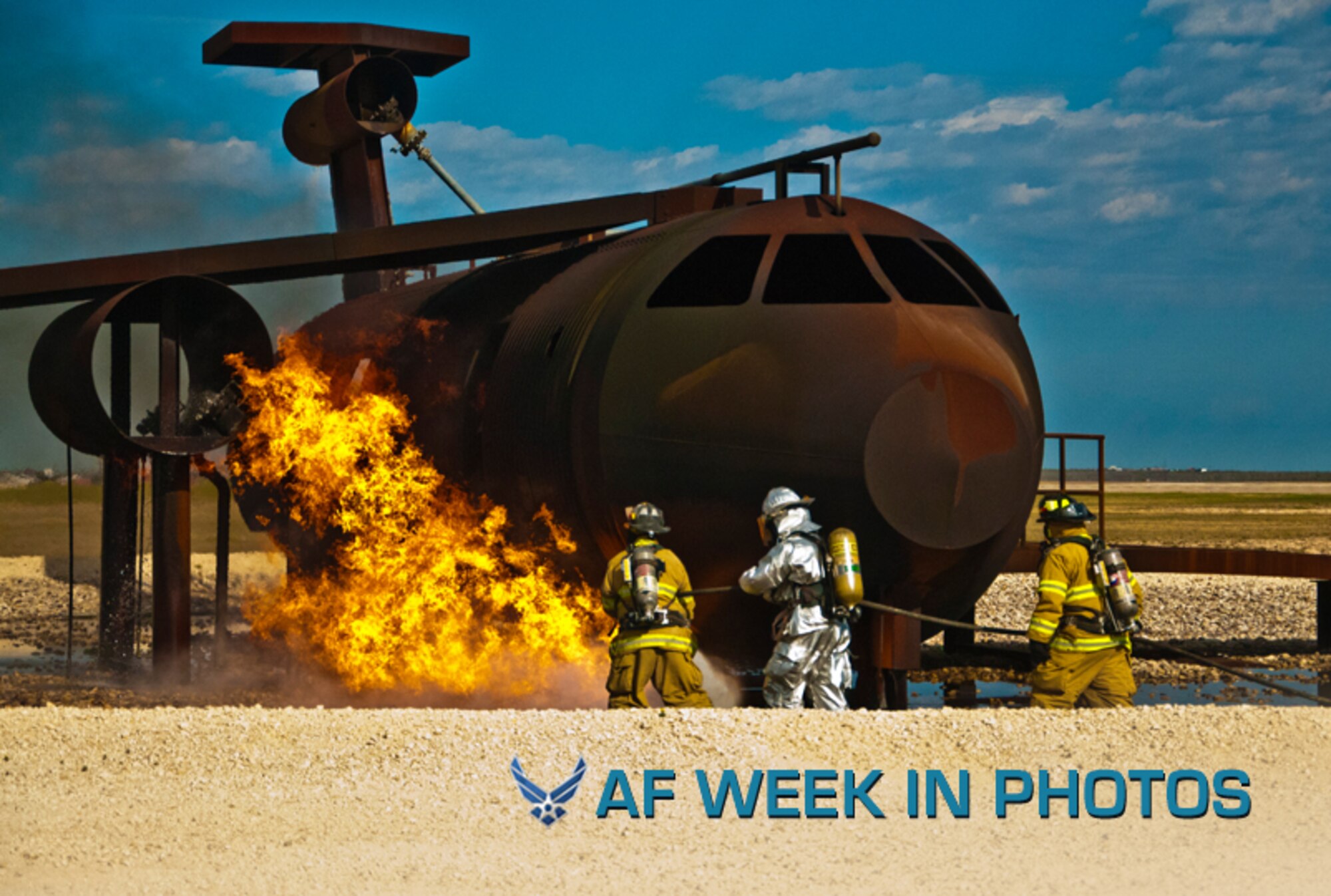 Members from the Laughlin Air Force Base and Del Rio Fire departments move in to extinguish a ground fire during a live fire exercise Feb. 11, 2013, at Laughlin AFB, Texas. The exercise was designed to help Del Rio firefighters maintain their currencies while training alongside Laughlin AFB’s firefighters. (U.S. Air Force photo/2nd Lt. Evan M. Ross)