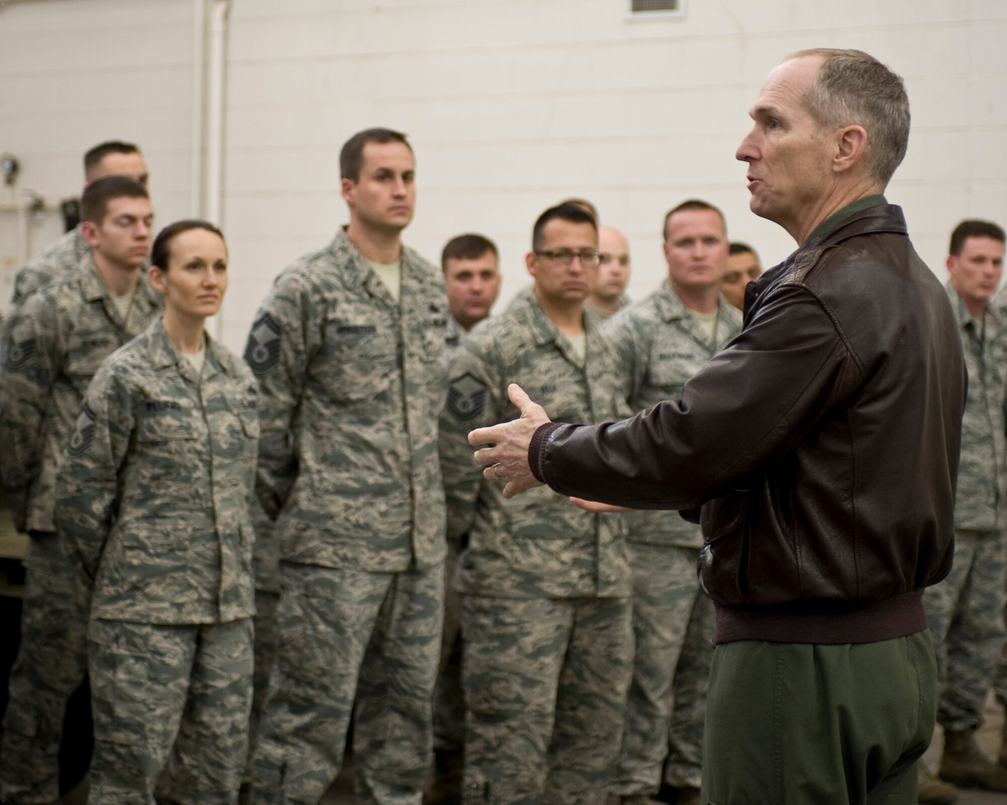 U.S. Air Force Gen. Mike Hostage, commander of Air Combat Command, speaks with a group of Airmen fromthe 7th Munitions Squadron Feb. 12, 2013, at Dyess Air Force Base, Texas. During his visit Hostage, expressed his gratitude and congratulated the squadron on their excellent rating during the consolidated unit compliance inspection that took place in January. (U.S. Air Force photo by Staff Sgt. Richard P. Ebensberger/Released)