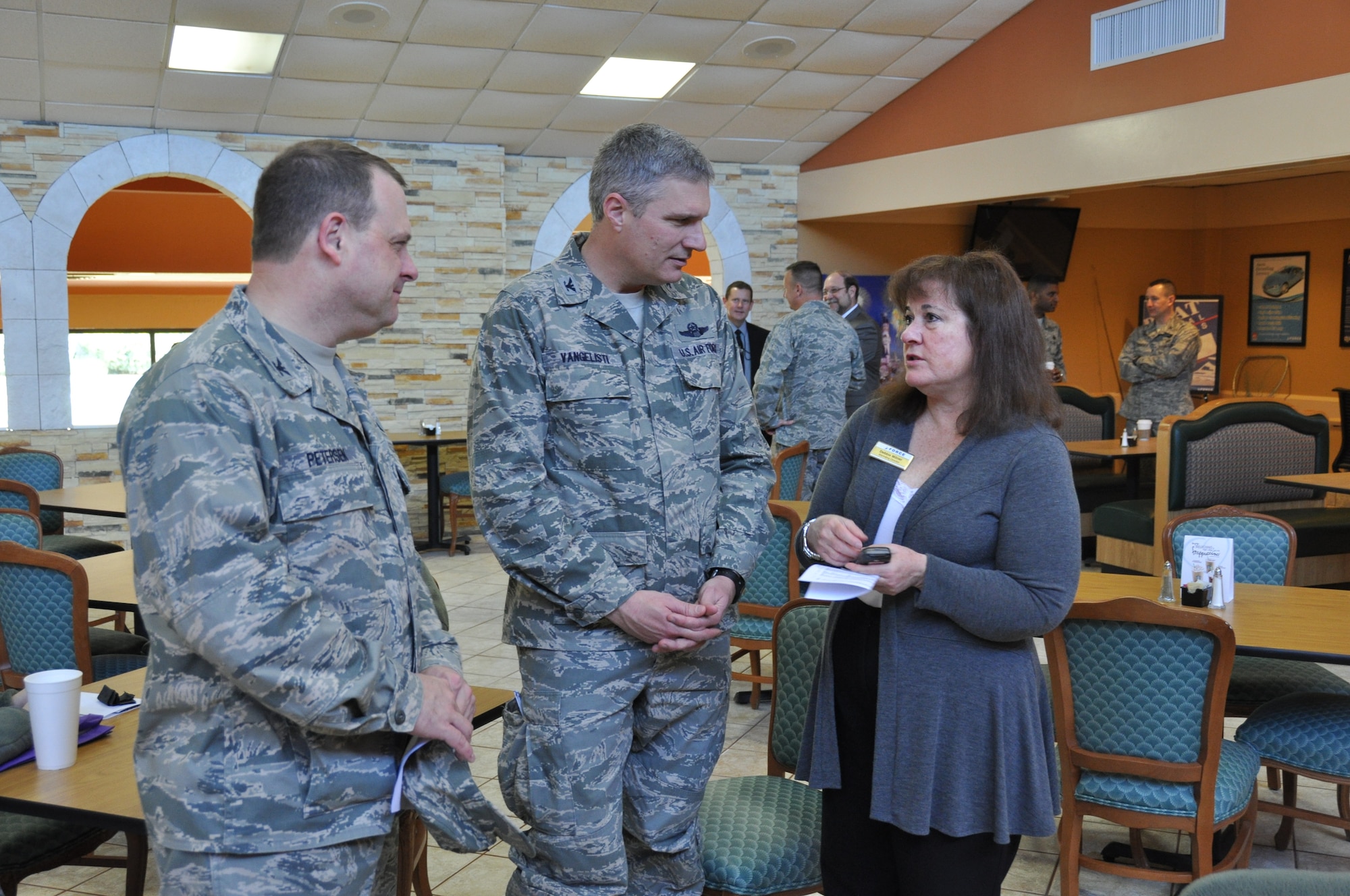 (From left to right) Col. Craig Petersen, 433rd Mission Support Group commander and Col. Aaron Vangelisti, Vice Commander, 433rd Airlift Wing, talk with 802nd Marketing Director, Debbie Milner about the amenities at the new Gott Commons Community Center” and “Heroes” restaurant, during a private tour and tasting Feb.13, on Joint Base San Antonio-Lackland. U.S. photo/SMSgt Minnie Jones)



