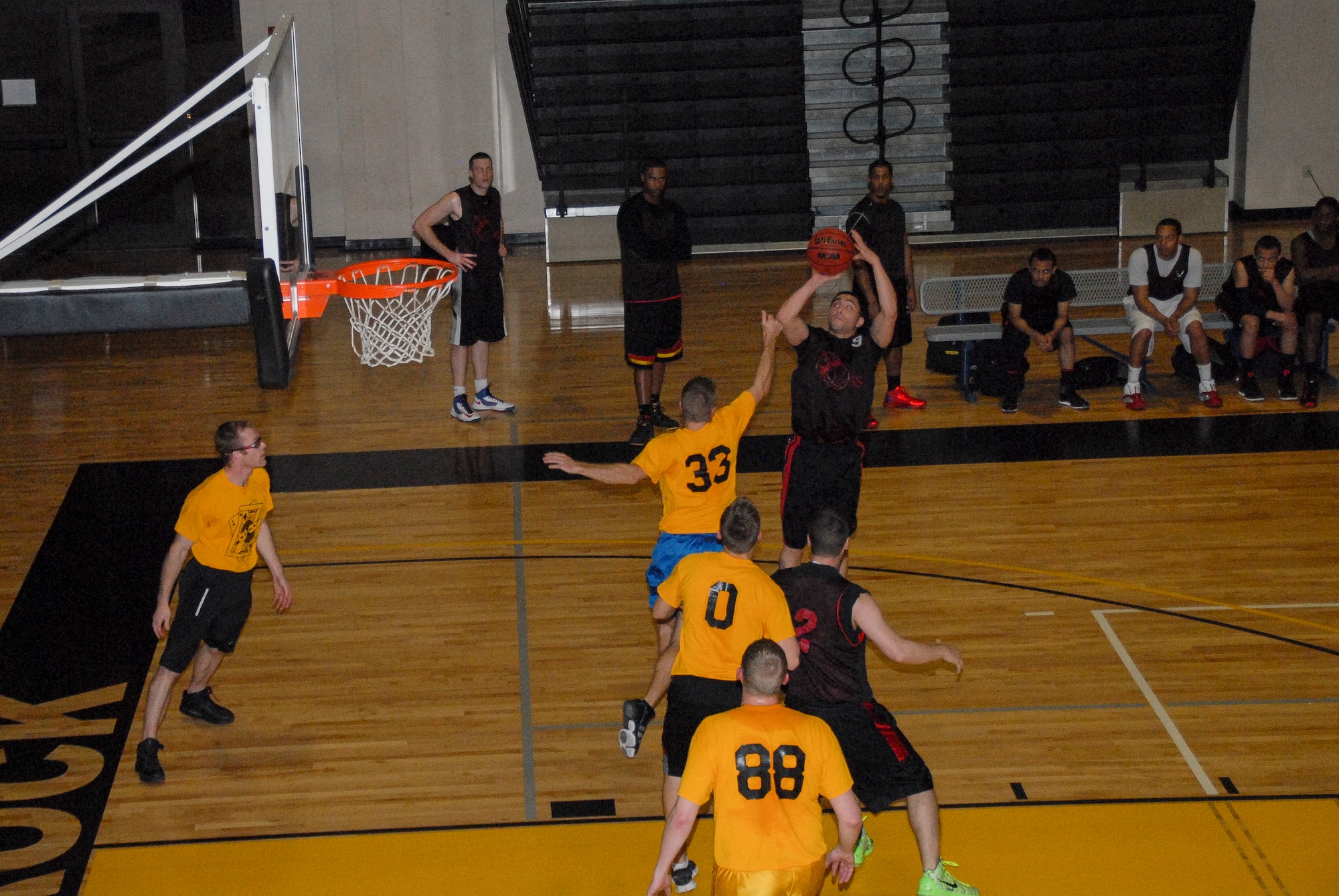 Aarron Ramos, 19th Operations Support Squadron, attempts a shot over a defender during an intramural basketball game against the 53rd Airlift Squadron Feb. 11, 2013, at Little Rock Air Force Base, Ark. Ramos helped lead the 19th OSS to a 47-45 victory against the 53rd AS. (U.S. Air Force photo by Staff Sgt. Jacob Barreiro)