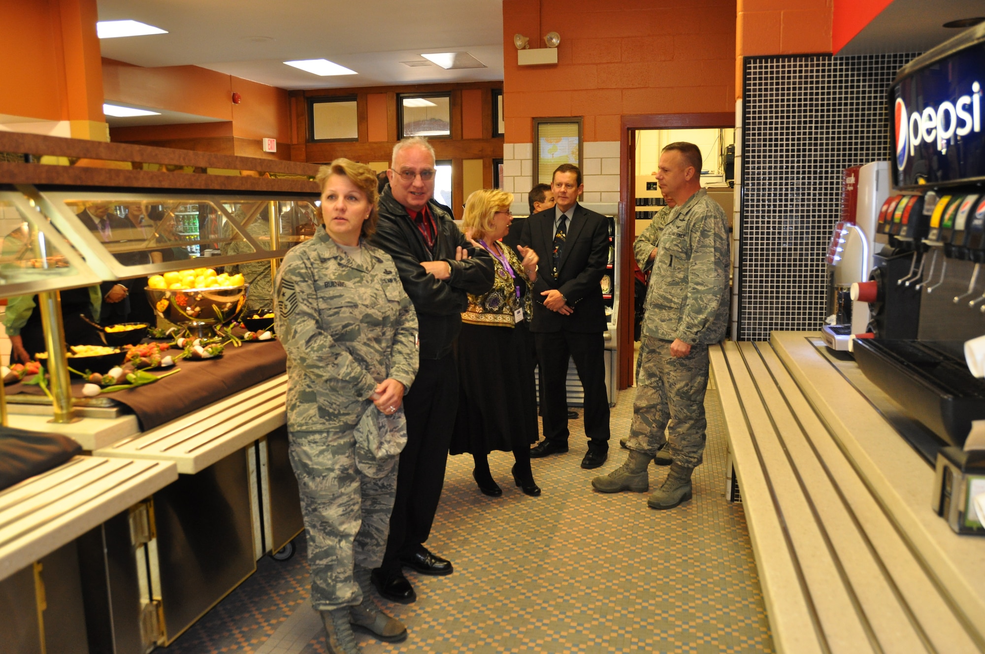 Lorraine Gonzalez, (center) Chief Financial Officer, Selrico Services, Inc. talks to Col. William Poirier, commander, 67th Network Warfare Wing, while giving a tour of the “Gott Commons Community Center” and the “Heroes” restaurant, Feb. 13.  Other members of the 67th Network Warfare Wing include, left to right, Command Chief Master Sgt. Rhonda Buening, Richard Martin, Director, Plans and programs and Richard White, Director, Information Operations.



