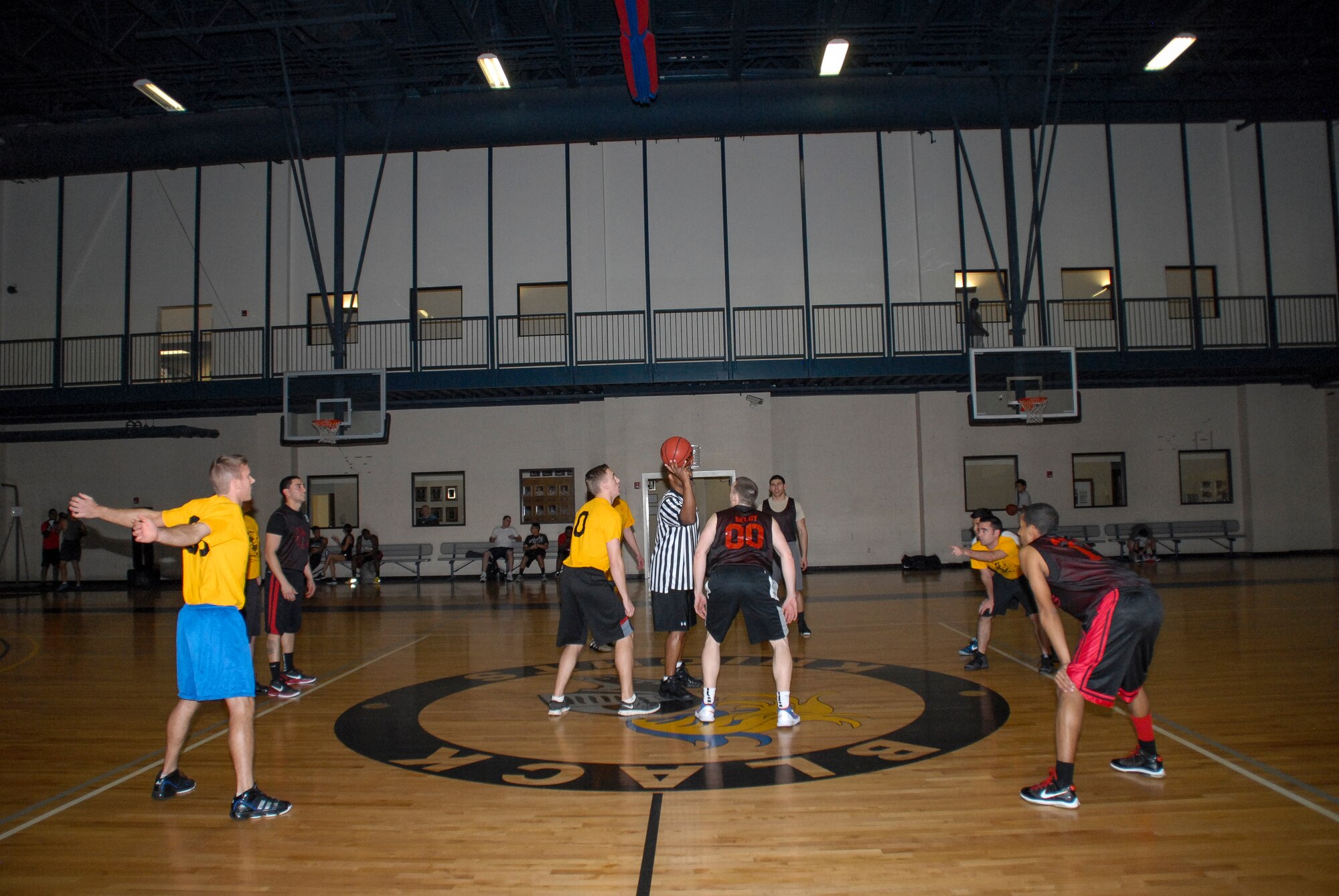 The 53rd Airlift Squadron and the 19th Operations Support Squadron prepare to tipoff for an intramural basketball game Feb. 11, 2013, at Little Rock Air Force Base, Ark. Base intramural games are held Monday – Thursday after duty hours. (U.S. Air Force photo by Staff Sgt. Jacob Barreiro)  
